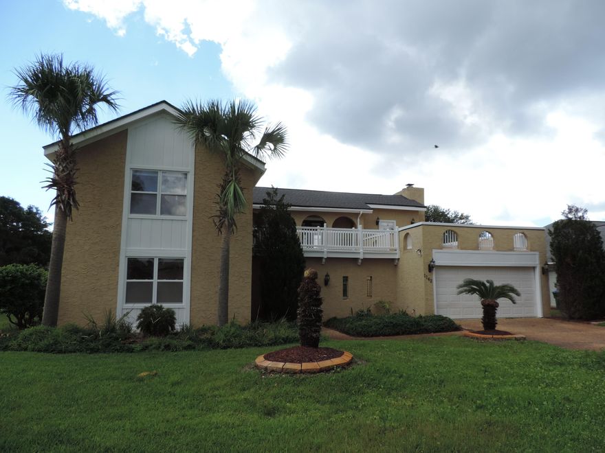 This waterfront executive home is in a great location. The home is situated on a protected canal, but offers a quick entry into the Sound and Gulf. Upon entering this remarkable home through the courtyard your eyes are naturally drawn to the massive Great Room with a large brick fireplace filling the entire end of the room. Adjacent is a cozy sunroom, great for your home office, or just relaxing and looking at the views. Continuing from either the Great Room or the sunroom you enter a large dining room with plenty of room for family gatherings. The updated kitchen is adjacent featuring maple cabinets, granite counters and stainless appliances. A bright and airy family dining area flows from the kitchen with French doors to enjoy the waterview and large back patio.