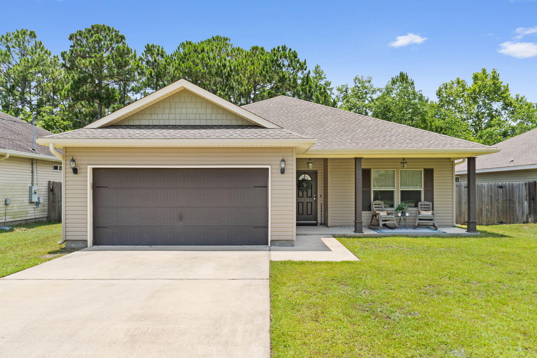 Welcome Home to this thoughtfully designed 3BR/2BA retreat in beautiful Navarre, FL. From the moment you walk in, you'll love the open concept, tray ceilings, and warm engineered hardwood floors underfoot. The kitchen features timeless granite countertops and flows seamlessly into the living space--perfect for gathering. French doors with internal blinds lead to a peaceful patio, ideal for morning coffee. The master suite offers two walk-in closets for effortless organization. With a new HVAC (2022), new water heater, and inviting front and back patios, this home blends comfort and charm in all the right ways.