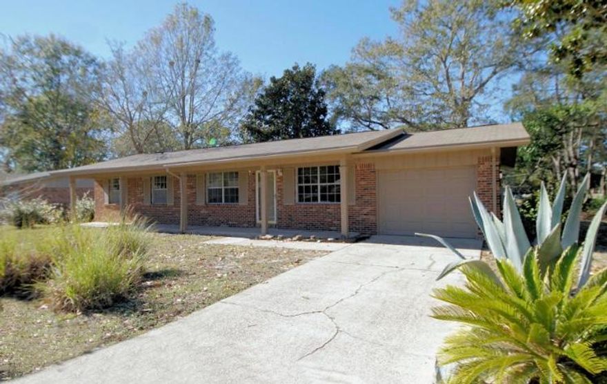 This 4 bedroom/2 bath ranch style house is located in a great family friendly and quiet neighborhood. Its covered porch welcomes you upon arrival with an entryway that brings you to the living room, with attached dining room, that leads to the kitchen with newer black appliances. To the left is the hallway that separates the 3 additional bedrooms and guest bathroom from the master bedroom with its own full bathroom. Adjacent to the dining room is a bonus room, which may serve as an additional family room, and leads you to the back patio that can also be accessed directly from the kitchen. The backyard is completely enclosed by chain link fencing, which is great for your pets. This house is located close to ball fields, a boat launch, and schools.