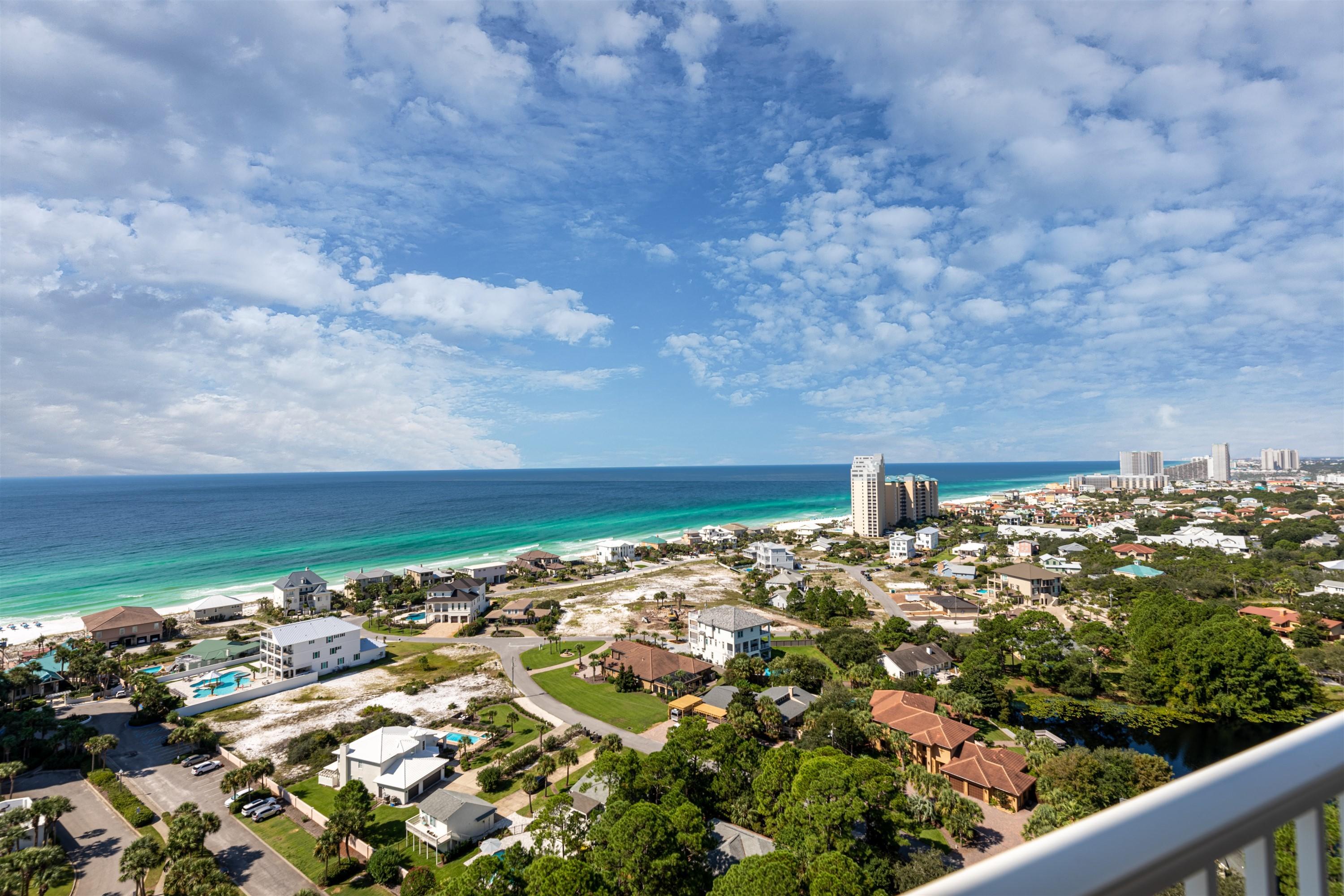 WOW!!! COME SEE THE SPECTACULAR SUNSETS AND ENDLESS VIEWS! One of a Kind SKY HOME located on the 21st floor in the Western Corner of One Beach Club Drive at Sandestin Golf and Beach Resort. This Tower Suite has it ALL with 4 bedrooms 4.5 baths and nearly 3300 sq. ft of Luxurious Living. This is a must see for anyone looking for a Very Special Property. There are 3 balconies in the condo including a 2 story balcony overlooking the Gulf of Mexico with over 1800 sq. ft of Sun Porches. Top of the Line Appliances Along with a Gas Stove and Custom Cabinets make the Kitchen a Gourmet Chefs Dream. There is also a Wine Cellar with Wine Refrigerator and Wine Bar. Stone and Hardwood Floors throughout the condo along with the Floor to Ceiling Windows. Pool Side Cabana and 2 Car Garage also convey.