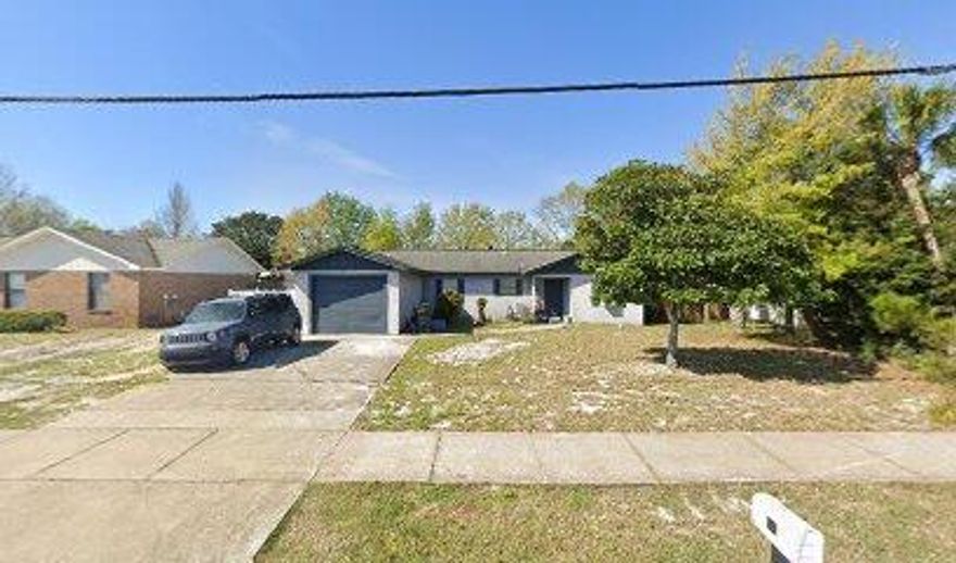 DESTIN LOCATION-NEW ROOF going on next few days .. Approx. .25 Acre   Handyman special in Destin, Copper wiring, Partial Garage conversion with good storage space. A Cozy wood-burning fireplace in the living room adds warmth and charm.Vacant and ready to view.