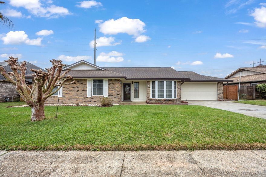 Welcome to 6 Tanglewood Circle in Fort Walton Beach, FL. This property is favorable to those being stationed at both Hurlburt Field and Eglin AFB for all Active duty and DOD personnel. The FWB Medical Center is a short drive away as well as many shopping and dining options. The Uptown Station and Emerald Place Shopping Centers combined offer stores such as Michaels, Ulta, TJ Maxx and Publix as well as some local restaurants including Buffalos Reef, Clemenza's and The Neighborhood Cafe. For outdoor enthusiasts, FWB offers many recreational stops along the way like Liza Jackson Park, FWB Rec Center and the Oak Tree Nature Park while a short 20-minute drive to Destin, FL brings you fishing, boating and relaxing on the beach. This inviting home features a spacious living area with vaulted ceilings and a cozy fireplace with a brick surround. There's a bonus room off the living and kitchen area, perfect for extra space. The kitchen is equipped with stainless steel and white appliances, a pantry, and plenty of counter space, along with an eat-in kitchen area. The primary bedroom includes a walk-in closet and a bathroom with a newer vanity and durable LVP flooring. Additional features include ceiling fans in all bedrooms and living spaces, a security system, a 2-car garage, a privacy-fenced backyard, and a spacious deck. Located in a desirable neighborhood with sidewalks, this home offers comfort and convenience.