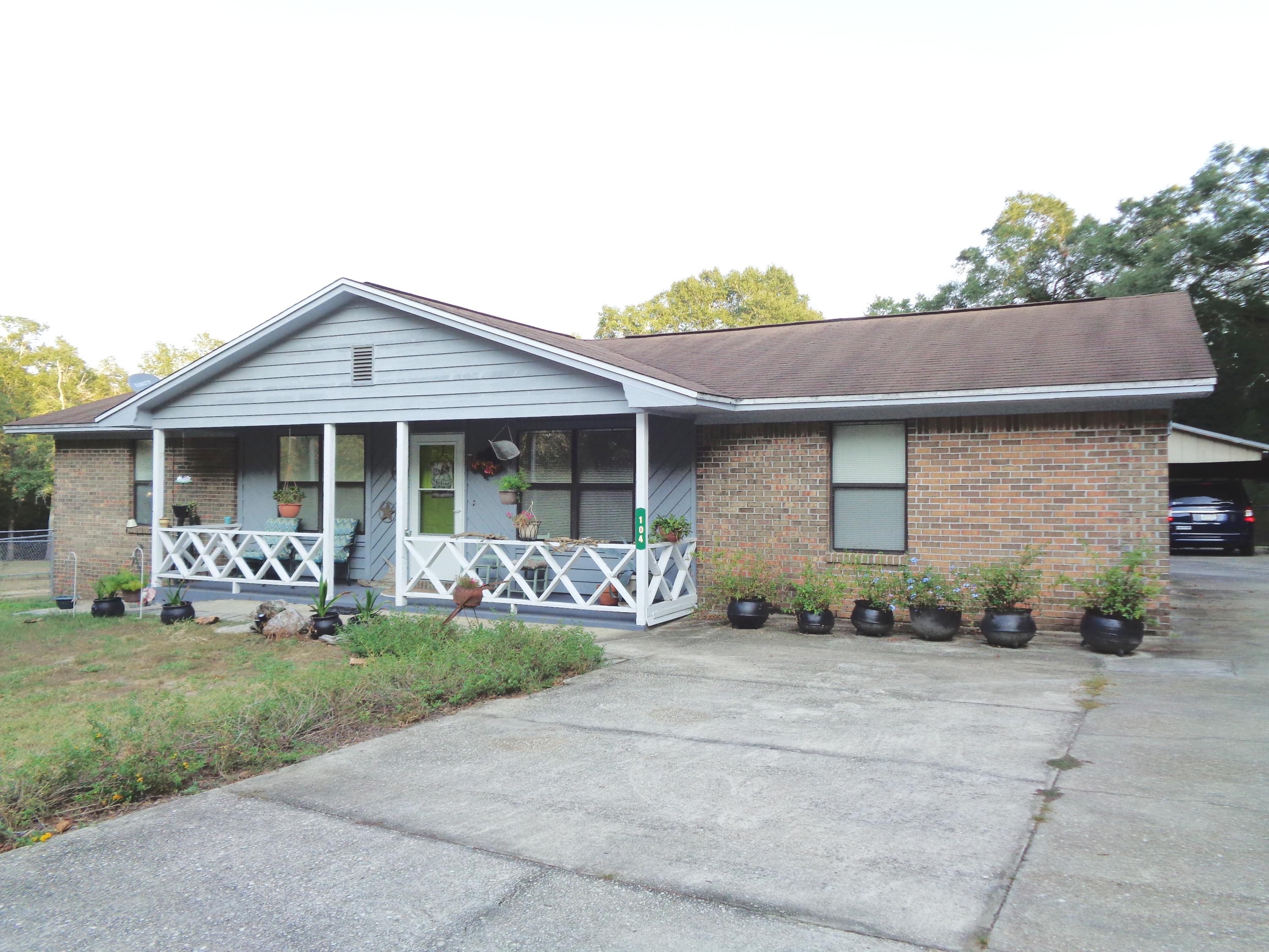Excellent opportunity to own 1.6 acres with a 3 bedroom, 2 bath in the City Limits of DeFuniak Springs. Sellers have painted the majority of the interior and exterior. They have also replaced the stove and refrigerator plus the water heater with an electric timer. Master Bath was completely updated as well as hall bath was updated. Some new flooring and new lighting has been added plus much more. Home features an open floor plan. Off of the kitchen/dining area is a 14x17 screened porch. Next to the porch is a 22x22 detached carport. There is also a 30x36 workshop/barn complete with 220 outlet and concrete floors. On the side is a craft/ sewing room with a window conditioner. Property is basically cleared and offers a great opportunity for a garden area.