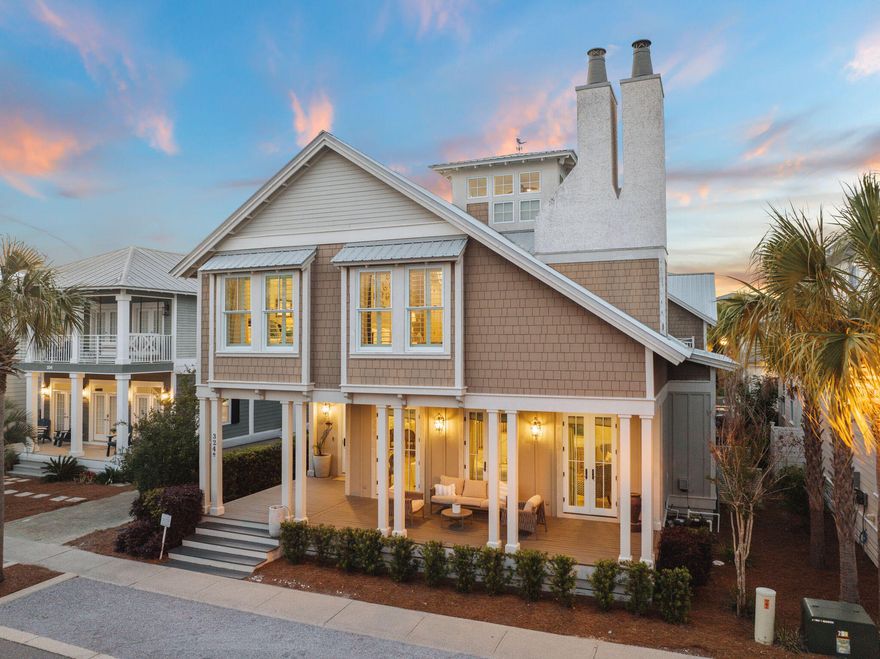 Ideally positioned in the sought-after Seacrest Beach community, this coastal home offers an exceptional blend of design, comfort, and functionality. Thoughtfully curated with high-end finishes and a seamless indoor-outdoor flow, the home stands apart with its spacious first-floor primary suite, detached carriage house, and an oversized parking area--an uncommon feature in this neighborhood. Beyond the welcoming front porch, the open-concept living area is framed by soaring 10' ceilings, pecky cypress-wrapped beams, and a beautifully appointed fireplace. The chef's kitchen, outfitted with Thermador appliances, custom cabinetry, and an oversized marble island, is designed for both effortless entertaining and everyday living. A wet bar and adjacent dining area further enhance the  home's gathering spaces. Two expansive porches extend the living space outdoors, offering multiple areas to relax or host guests. The second level features generous guest suites and a charming bunk room, while the third-floor tower room provides a versatile retreat leading to a rooftop deck with an outdoor fireplacean ideal setting to take in panoramic views and sit with friends. A detached carriage house with a private 1-bedroom, 1-bath layout and approximately 1,000 square feet of living space offers additional flexibility, whether for guests, rental potential, or a home office. Recent updates include an EV charger, fresh paint, and whole-house shutters. A gas-powered golf cart is also included, allowing for easy access to the surrounding area. Perfectly situated along Scenic Highway 30A, Seacrest Beach is home to a stunning 12,000-square-foot lagoon pool, private deeded beach access, and winding trails that lead to the world-class dining, boutique shopping, and iconic architecture of Alys Beach and Rosemary Beach. Offering a rare combination of thoughtful design and prime location, this exceptional property presents a compelling opportunity for both investors and those seeking a refined coastal retreat.