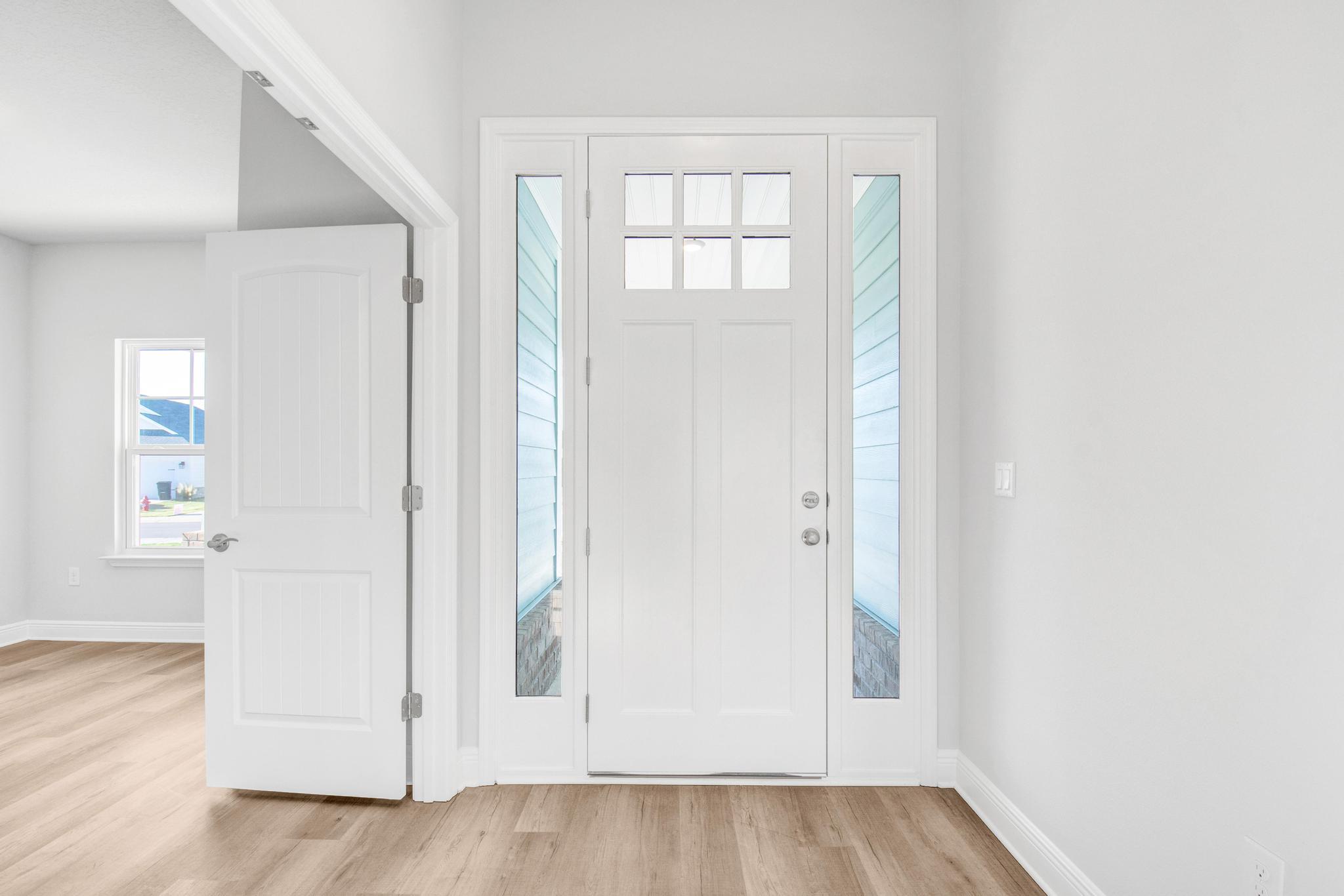 Limited time offer: Receive up to $25,000 Flex Cash! Use it towards options, interest rate buy-down and any combination of HOA fees, prepaids and closing costs with our preferred lenders.Just a 20 minute drive to South Walton beaches or a 15 minute drive N to DeFuniak shopping. Craftsman 4 BR/2 BA home with Hardiboard siding and brick skirt. LVP flooring throughout, no carpet. Cathedral ceiling in the main living area, all ceiling heights are 9' or higher. 8' entry doors, quartz countertops. Master Bedroom has a large walk-in closet. Master Bath has a garden tub + separate shower and dual vanities. Sprinkler system w/ well + pump, garage door opener, attic pull-down stairs.