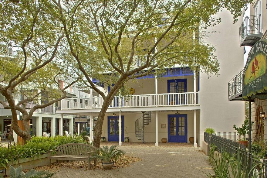 Nestled between Seaside's Central Square and Ruskin Park sits Early Morning Hours. This unique home in a unique neighborhood overlooks the Park and the magnificent Seaside Chapel and has been featured in the book 30A Style. Built for a family, this is a true home. The home shares its' first floor with one of Seaside's finest boutiques. This retail space provides year round income. Starting from the top of its' 4 stories is a comfortable tower room accessed by both sculptural stairs and an elevatorwith plenty of room to house your reading collection (or kids' bunk beds). It opens onto a roof deck with views of the Gulf, Seaside's glorious Chapel, Ruskin Park and all of Seaside's rooftops. It offers a perfect place to relax in the sun, watch the early morning sunrise o