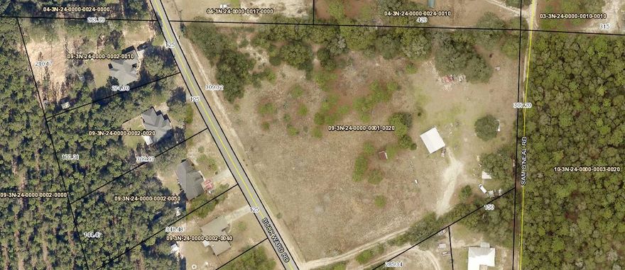 5.9 Acres in Baker, FL with old 1993 MH, Sold ''AS IS CASH ONLY'', no repairs or warranties. 628  SF Frontage and 308 SF on Sam O'Neal Rd at back of property. Property clear with some mature trees and wire fencing. Room sizes of MH approx. Buyer to confirm. Large open covered porch on front of MH approx. 10x30. Survey done with ability to split property into 3 lots.