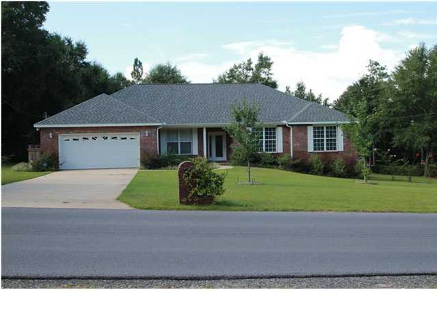 Great home in a very convenient location. You can practically see Bob Sikes Elementary from the front door!!! Wonderful like new all brick home on nearly a half acre lot. Plan features four bedrooms--one of them is conveniently located to use as a study or guest room. The great room is very large with a corner fireplace. New stainless steel appliances in the kitchen (great gas range with griddle!). Kitchen has a huge breakfast bar! Formal dining room with trayed ceiling. All of the bedrooms are spacious. The lot is beautifully landscaped and the sellers have a portion of the back sectioned off where they have had a bountiful vegetable garden and still plenty of lot to play on!!! There is a deep well for watering and it can also feed the home with delicious water or you can switch
