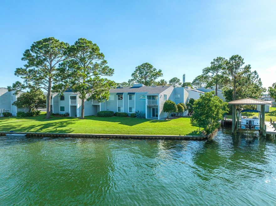 Gated, Waterfront and VA approved community of Finisterra is nestled along the Choctawhatchee Bay, located at the end of Old Ferry Road across the street from Shalimar Yacht Basin & Marina. This is a great location in this gated complex offering privacy and convenience being located as an end unit on the bottom floor. You'll love this 2 bedroom, 2 bath condo, with amazing Bay views and private patio, open floor plan, tiled floors throughout, updated kitchen with stainless steel appliances and breakfast bar as well as a newer A/C. The master bedroom is spacious with private bath, and guest room with closets including built in shelving. Convenient assigned parking space is steps away from this unit. The Finisterra complex offers a lighted tennis court, pool, sauna, on-site laundry facilities