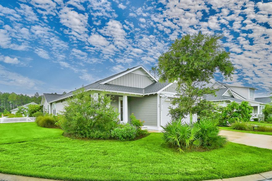 Coveted 3 bedroom, with an office and 3 bath home with panoramic water-views in one of the most secluded sections of WaterSound Origins. 39 E Sandlefoot is an upgraded ''Bayberry II'' by Huff Homes, their most desirable floor plan. Sprawling .18 acre corner lot, with a serene pond in the front and community green space in the back, this home induces tranquil living. Numerous upgrades including hardwood floors, quartz countertops and epoxy floors in the garage. The kitchen features top of the line appliances from brands such as Bosch and Sharp. A thoughtful upgrade can be seen in the kitchen with the dry bar featuring additional cabinets and an elegant tile backsplash. The living and dining areas seamlessly flow together, great for keeping everyone included and entertaining.