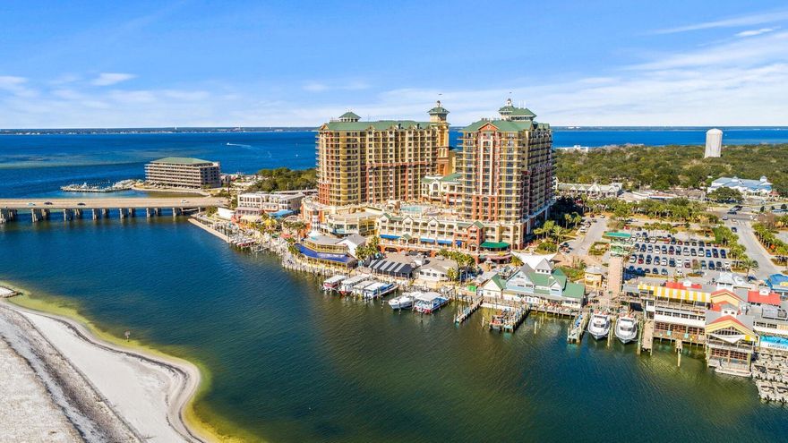 Spectacular views of the Destin Harbor, East Pass, Destin Bridge, Crab Island and the This condo is located on the pool deck and has convenient access to the pool, hot tub, bar, restaurant, and HarborWalk Village. Gulf of Mexico make this the most desirable condo on the Emerald Coast. Amenities galore include 9700 sqft European spa and fitness center, state-of-the-art business center with high speed wireless internet, on site restaurants and lounges, two marinas, full service valet, underground parking and ultra luxurious pool deck with harbor views. Interior design features include 9ft ceilings in main living area and spacious balcony and grand terrace. Crown molding throughout. Kitchen includes stainless steel GE Profile appliances, granite countertop with bar and Italian porcelain