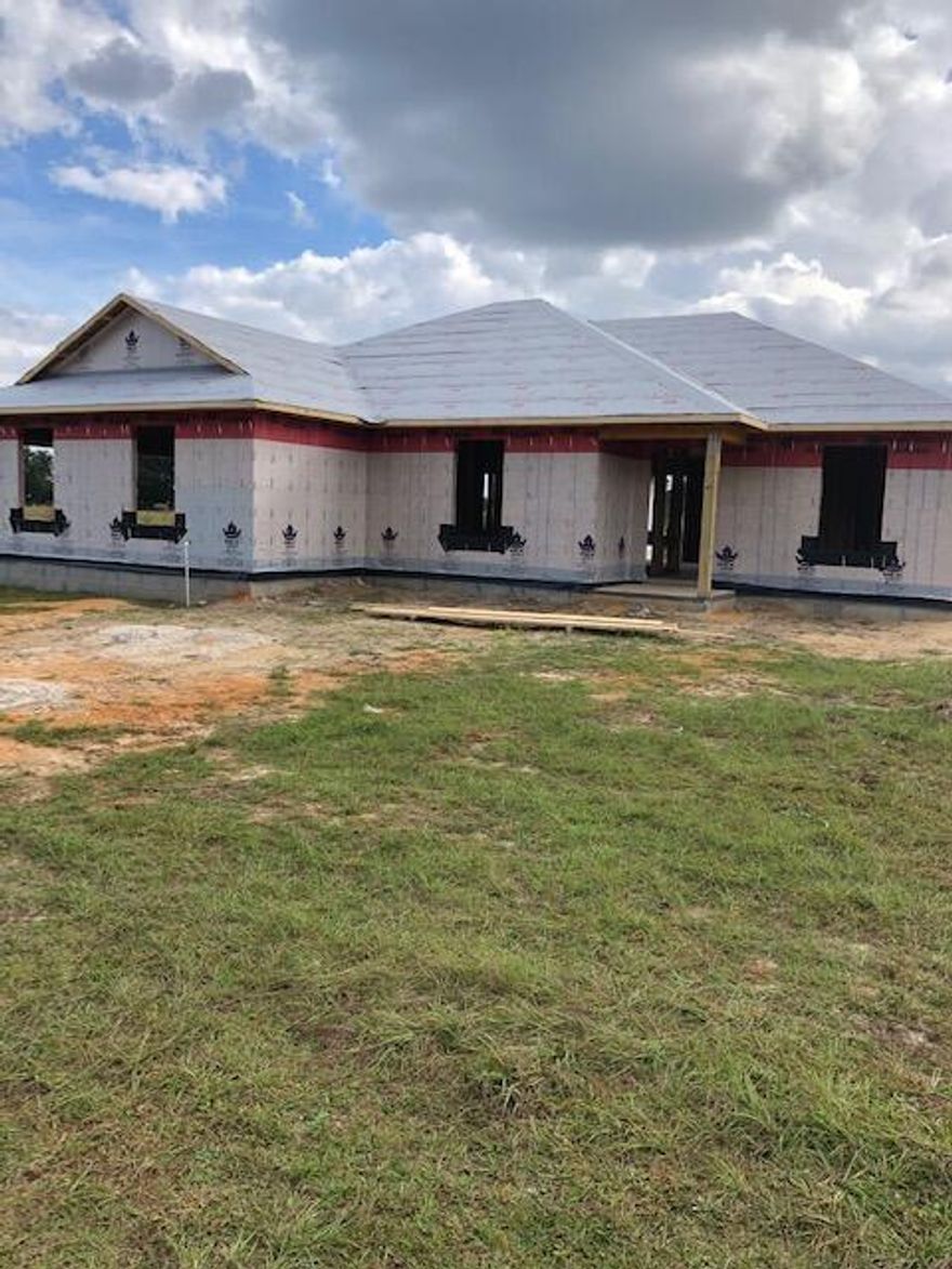 A rare find!! 3.43 Acre Lot, NEW all brick home close in! No skimping on Quality of this home built by Local Quality Builder that  is affordable.  Level lot - on a dead end road.  Solid wood Cabinetry, Granite Kitchen Counter tops.  ALL flooring Luxury, ''Lock & Lay'' vinyl.  Great split bedroom floor plan, spacious guest bath, nice master bath with dual sink vanity, soaker tub as well as separate shower,  Nice Walk-in Closet, inside laundry.  Covered back porch    This is an energy efficient home  close in, but outside city limits so no City taxes.    Nice, neutral, popular decor.   See colors and finishes list under 'documents'  as well as survey of property and floor plan.  Completion date on or before 3/18/22,  A total of 16 pallets Sod will be installed, a lot in front, approximately