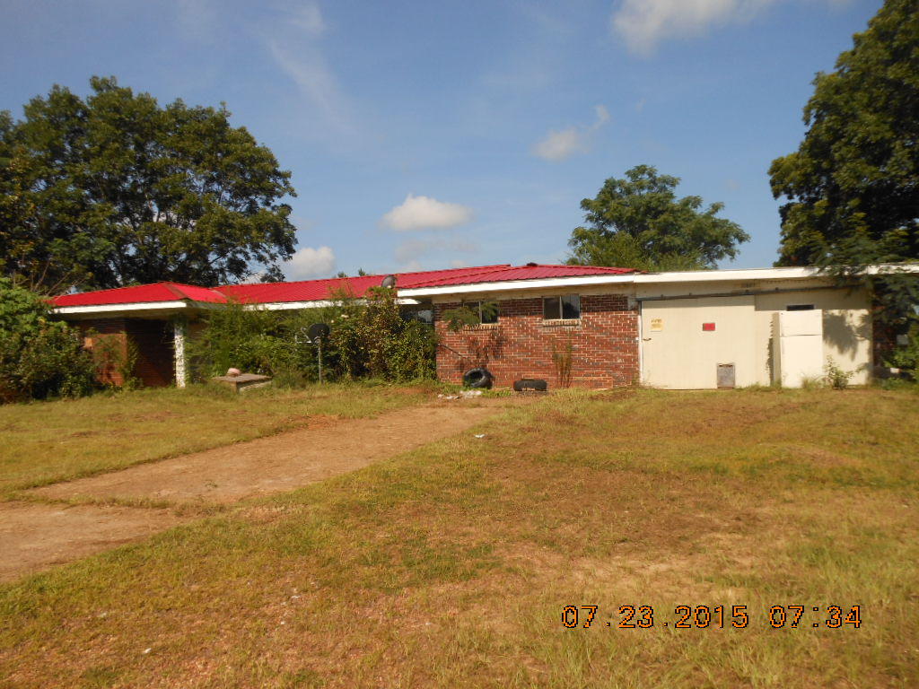 If you're looking for property with acreage, two homes, a barn, and elbow room, look no further. This handy man special can be remodeled to your taste. It is being sold as is. There are two homes. The main home is 2027 SF brick with 3 bedrooms,two baths, attached garage. The other home could be a mother-in-law cottage. It is 44 years old, masonite siding, 1740 SF, 2 bedrooms, one bath. Both have metal roofs. Seller is not removing any personal property and buyer is aware it is sold as is where is. Probate process has begun. Land is mostly cleared and fronts county dirt road near Esto, FL, one mile to pavement. The 4000 SF barn is quonset style steel building is spacious with concrete floor. Fig tree and pecan trees in yard. Call to schedule a showing today!