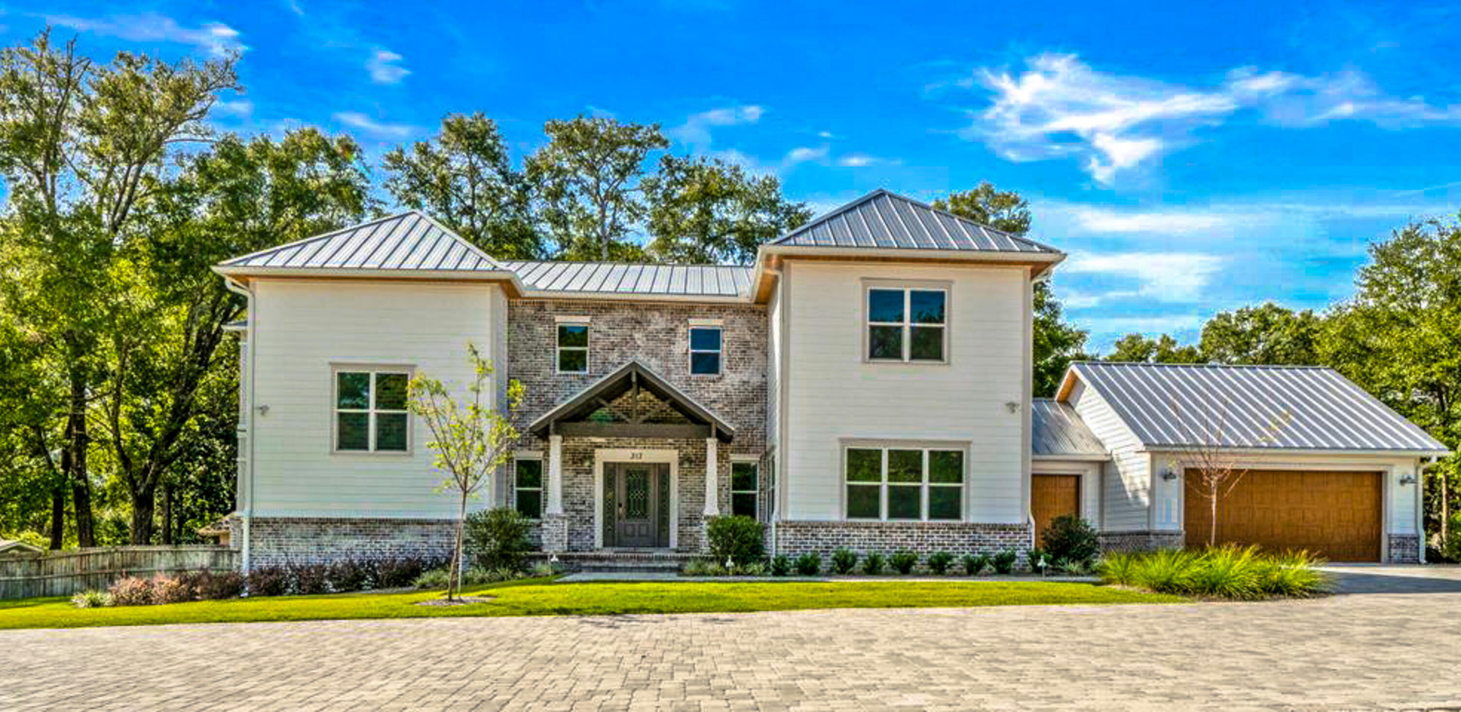 Great opportunity to own and enjoy this beautiful, luxurious home with a dock / boat slip! As you enter the kitchen the Carrara Marble counter tops and Cardozo Deco Spanish tile backsplash are sure to stand out. The farmhouse sink, bar-top island, soft close shaker cabinets with LED lighting underneath, a 64' dual freezer refrigerator, hand sensor faucet, under counter microwave, double oven, Verona 5 burner gas range all add up for one amazing kitchen! Off the kitchen is a spacious pantry hidden by a barn door and a Mud Room with a hand laid penny floor. This open design features 2 living rooms, separate dining room, 2 Master Suites (one on the main floor and one on the second floor) with balconies w/ fans and large walk-in closets. The home also features 3 guest rooms, 3.5 baths, 24-gaug