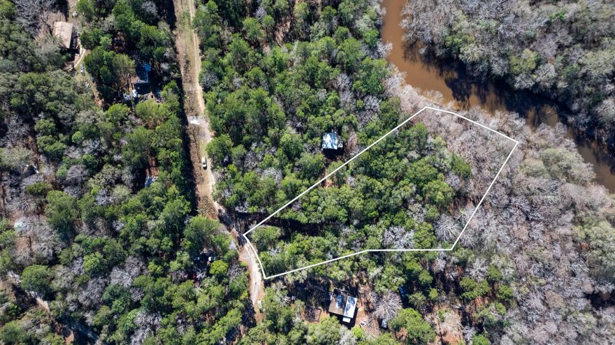 BELOW MARKET VALUE, PRICED FOR QUICK SALE!!This rare 2.5-acre parcel on the Yellow River in Crestview. Enjoy direct river access while remaining conveniently close to shopping, dining, and other Crestview amenities. The 1500 sq. ft. fish camp is being sold as is. Bring all offers.Property being sold as a Lot. The house on the property is not being identified and is being sold As Is.