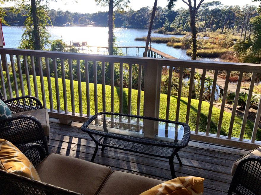 Amazing view of the bayou from this fully updated end unit townhouse with designer features. Best value for waterfront in the area. Plenty of space for living inside and out. The kitchen features granite countertops, kitchen island with granite inlay, new stainless steel appliances, and a glass tile backsplash. The 17'x10' deck overlooking the bayou is perfect for dining and relaxing. The living room has new handscraped flooring throughout and 9' ceilings. Tile floors in the kitchen and bathrooms and new carpet in the bedrooms. Incredible location just 10 miles to Destin and 7 miles to Eglin AFB, also convenient to shopping, dining and schools. Bring your paddleboard or just take in the scenery from the dock. The deck and patio are West facing for enjoying evening sunsets.