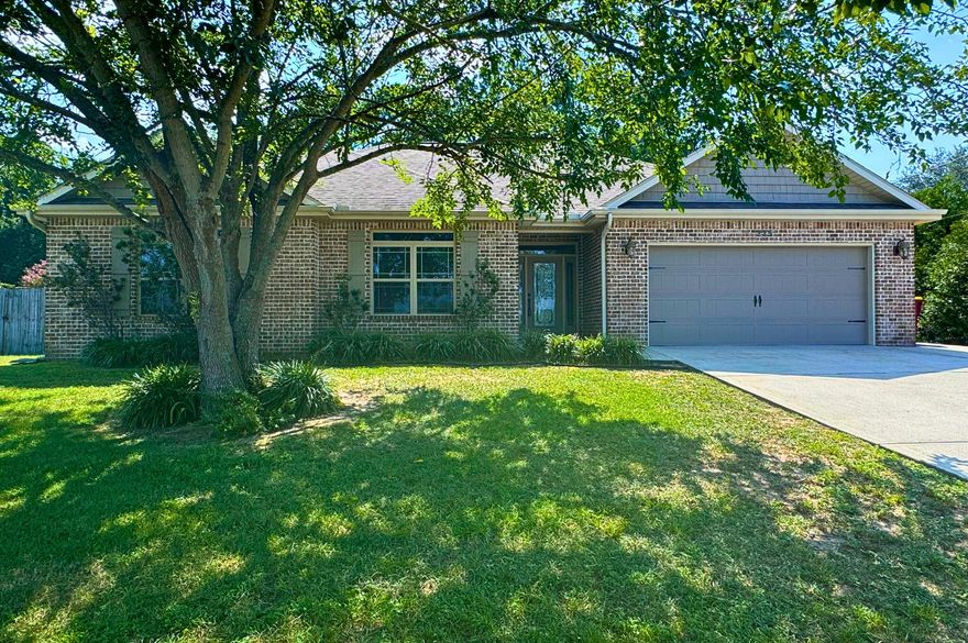 Don't miss out on this 4/2 located in South Crestview off of PJ Adams. As you enter the home, you have three generously sized bedrooms and guest bathroom down the hall to the left. There is tile flooring in all of the main areas and carpet in the bedrooms. This home has an open floorpan. The living room has a beautiful tray ceiling and the kitchen has granite countertops, island, bar seating, backsplash, pantry, and stainless steel appliances. The primary bedroom is spacious with a tray ceiling, walk in closet, and a primary bath with marble countertop double vanity, soaker tub, and marble stand up shower. Enjoy privacy in the backyard as it is surrounded by a 6ft wood fence.