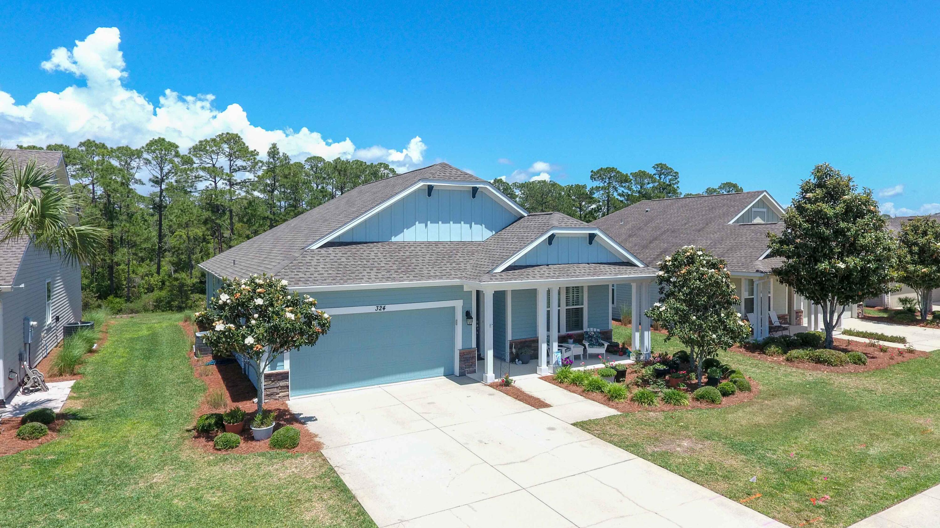 Welcome to your new 3/2 custom home in the Whisper Dunes neighborhood on the west end of Panama City Beach. This home backs up to Conservation lands which provides ultimate privacy in your backyard and the home is located in a non-flood zone. You are only 20 minutes from the Panama City Beach Airport and 7 minutes to Rosemary Beach along the scenic 30A Highway corridor. This home features granite counter tops in the kitchen and bathrooms along with soft close cabinets and drawers. The roof was replaced and exterior painted in October of 2023. HVAC was replaced in September of 2024 and includes a Nest Operating Thermostat. The back patio is screened in along with an extra pad for your grill. Never mow the yard again yourself since the HOA provides yard maintenance.