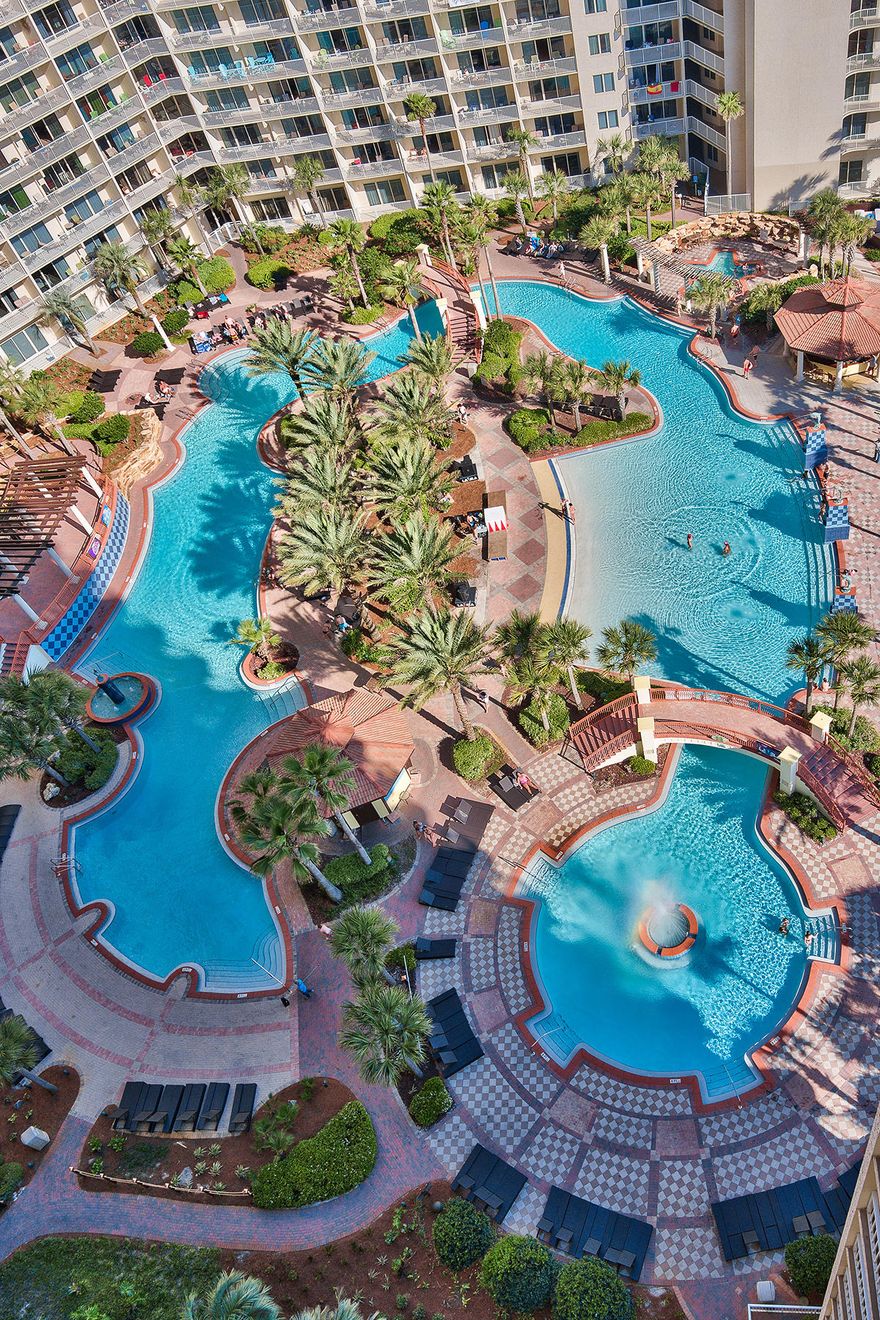 OWNER FINANCING AVAILABLE! Enjoy unobstructed panoramic views of the pool and beach from this gorgeous corner unit. This floor plan is the most sought after plan in the building. The unit features large sliding glass doors, a true Gulf front master bedroom with access to the balcony, Luxury Vinyl Tile throughout which looks like hardwood flooring, a new upgraded washer and dryer, upgraded light fixtures, flat screen TVs, and a separate bunk room with a door (just like a 3rd bedroom). This unit is nicely furnished and will not disappoint anyone. It also comes with an ASSIGNED DEEDED COVERED PARKING SPOT so you'll never have to worry about finding a parking place in the garage.