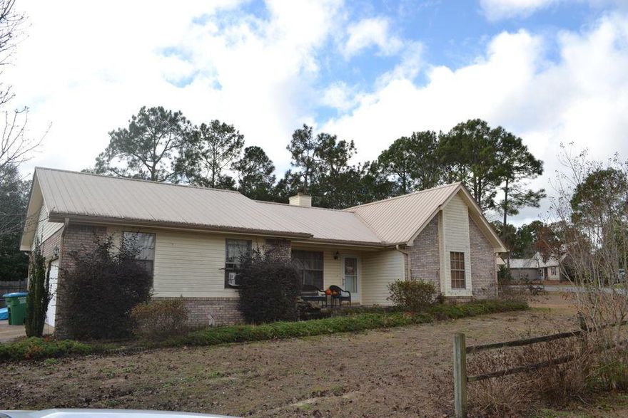 Very affordable 3 bed, 2 bath home in Crestview, south of I10. This home includes a large corner lot with irrigation system and workshop. The metal roof was installed on 2005. The interior of the home features tile flooring, plantation shutters and an all brick fireplace.
