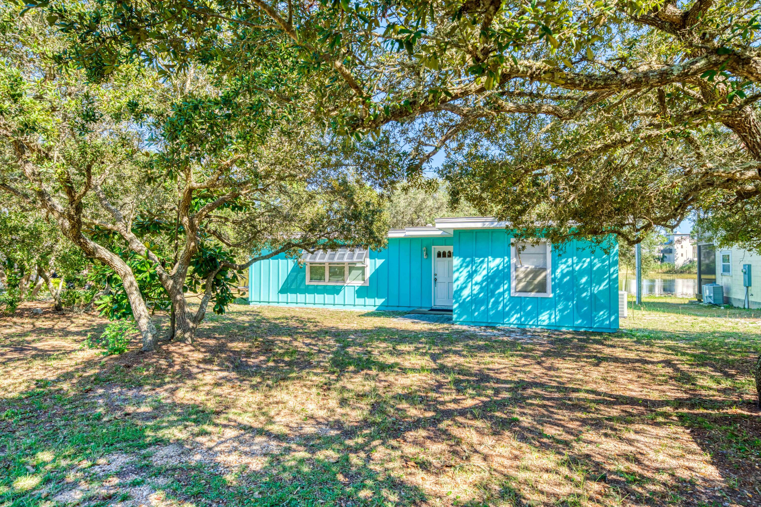 You will find 211 Lakeview in Old Seagrove that special place which slowly matured from a small beach village to the thriving sophisticated retreat it is today. This bright beach blue cottage has made memories for a South Georgia family since the sixties. The family found this perfect spot on one of the local coastal ponds just steps from our beautiful gulf waters and the white shimmering sands of the beach. Seagrove and 30A grew up around it while it provided an escape for all who visited.It is time for the family to let it go. Lots are few and far between south of 30A and  close to the beach. The property is situated between 2 walkable public beach accesses, and yet close to all that makes Seagrove special. It is your turn now....