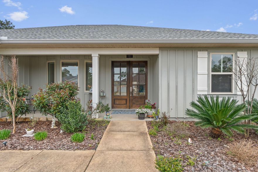 Stunning 4BD/2.5BA coastal home built in 2020 and well maintained featuring, double mahogany entry doors opening to a bright, open-concept living area with luxurious vinyl plank flooring throughout. The gourmet kitchen is a showstopper with custom cabinetry, quartz countertops, and under-cabinet lighting. Retreat to the private, split-plan master suite with a trey ceiling, custom walk-in shower, double vanities, and a massive closet. Relax on the large covered patio overlooking the private backyard. Includes an oversized 2-car garage. Located just minutes from a boat ramp, white sandy beaches, dining, and shopping!