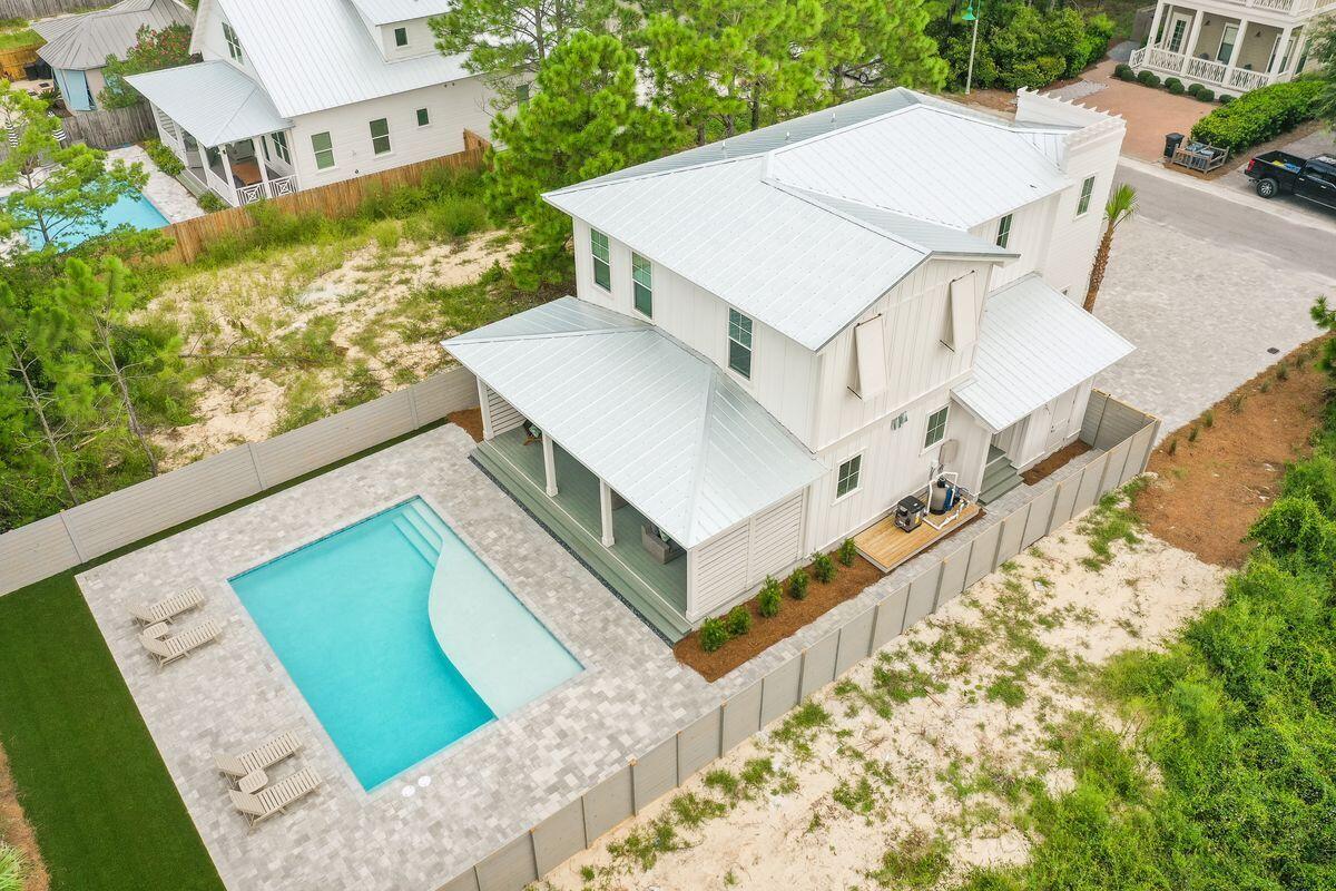 Under contract - accepting back ups. Welcome to ''Coffee and Starfish'' - a truly remarkable 4-bedroom, 3.5-bathroom property located in the heart of Seagrove Beach, Florida. This stunning new home boasts a luxurious interior and a prime location, being just a few steps away from the soft, white sand beaches of 30A, providing easy public beach access. With a capacity to comfortably sleep up to 10 guests, this home is perfect for large families or groups of friends.Upon entering the property, you are greeted by an exquisite and spacious living area that is open-concept, with the kitchen, dining, and living room all perfectly designed for entertaining. The kitchen features brand-new premium appliances and ample counter space for meal prep on the five-burner gas range.