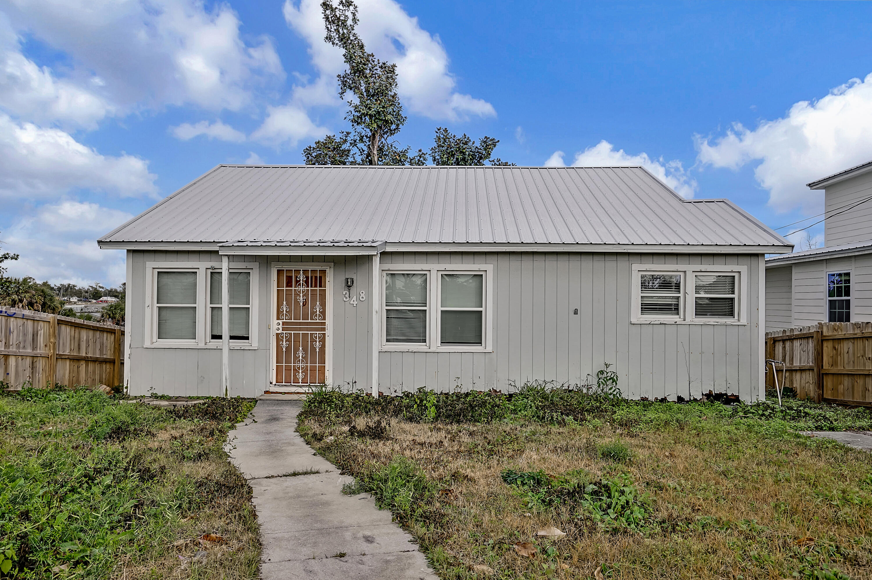 pending, with inspection contingency, Taking backups. Opportunity is knocking, Builder/Flippers dream opportunity. 1949 Old Florida Cottage. This home is empty, ready to flip, for some great profits. Have you seen the cove lately? The prices are going up, & the homes are all being purchased & upgraded. The home is 1078 sq foot heated & cooled with a basement that is also 1078 sq foot. Newer AC & Newer Metal Roof since Michael. Buyer will have some good possibilities here. The lot is double size in length at 150 feet. It has a back entrance as well as a front entrance. This property is convenient to Downtown, as well as Panama City Beach & Tyndall Air Force Base. Cash Only offers, AS IS, Come see it and see what you can do.