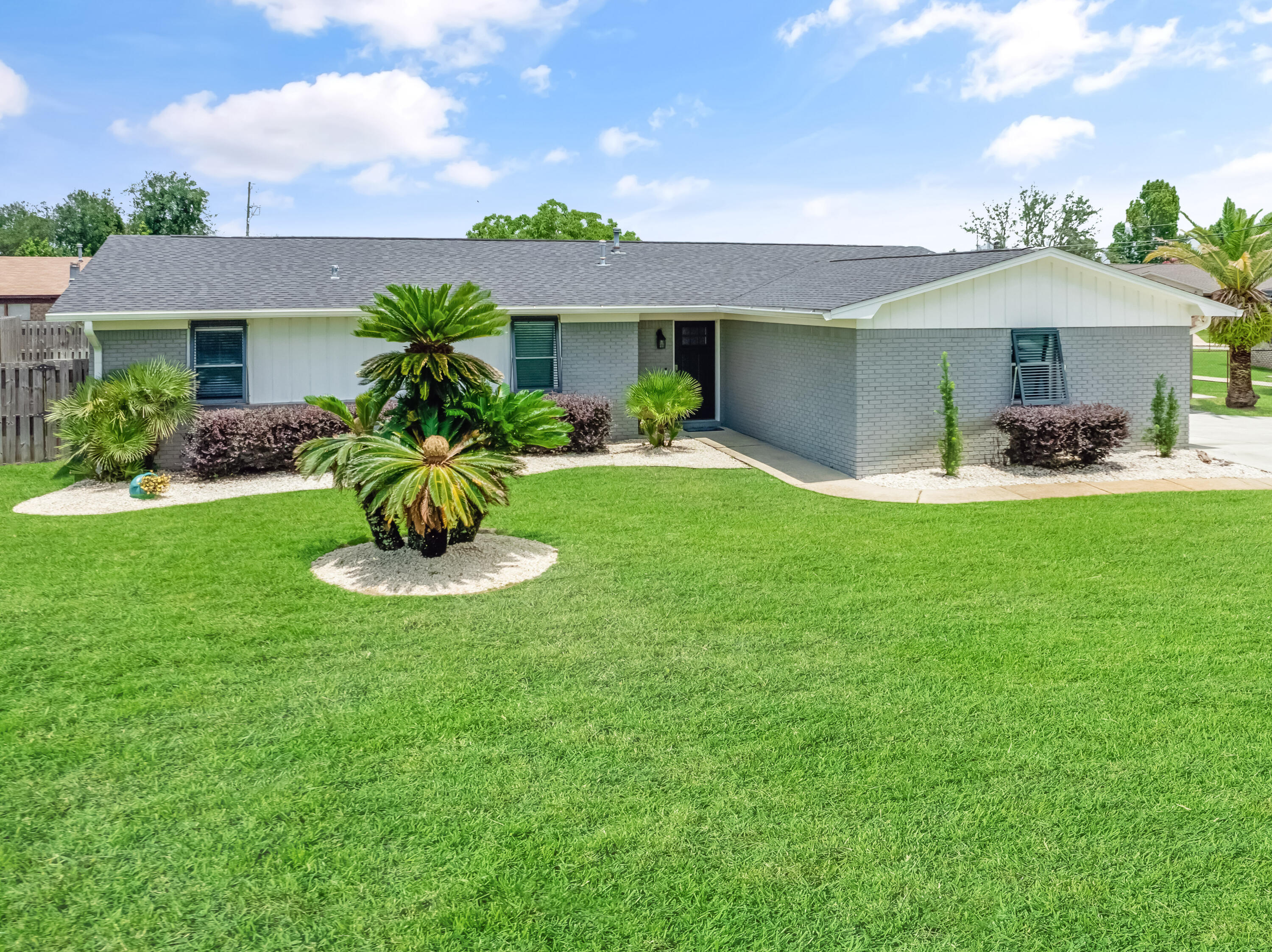 Welcome to your dream home at the beach. This stunning SFH underwent a full renovation in 2020 including new roof. With many more upgrades completed in 2024, new pool pump, patio awning, pump well, sprinkler system, recessed can lighting and living room layout redesign. The kitchen has gas oven and range, island with breakfast bar and sleek granite countertops. The home's southeastern exposure fills the room with natural light, while the new Bahama shutters provide charm and peace of mind. Arts and Crafts enthusiasts will appreciate the dedicated cooled studio space, offering a perfect workspace. The primary bedroom has an ensuite bath showcasing exquisite granite finishes. Outside, the private covered patio & pool create an ideal setting for entertaining or unwinding in private oasis. Enjoy the convenience of a fenced backyard along with enough space for a boat or RV in the extend driveway. There is even a dedicated RV electrical outlet. Don't miss this opportunity to own a beautifully renovated pool home across the street from East Bay. Other stats include: 4 miles from Tyndall AFB, 5 miles to Historic Downtown PC and less than .25 mile to Under the Oaks Park and Pier 98 Marina. If you want to get to other sugar white sand beaches, you are 18 miles to Mexico Beach and 22 miles to Panama City Beach.
