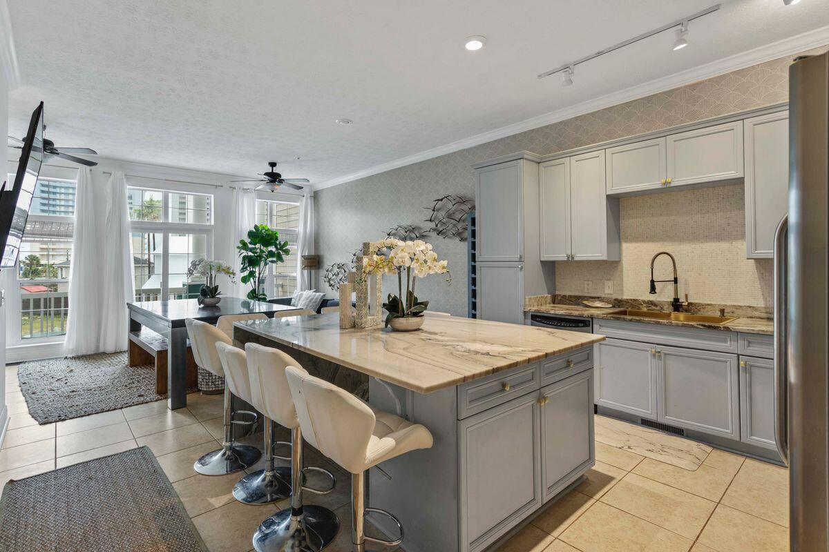 This newly updated 5 Bedroom, 4 1/2 baths Townhome is located just off Front Beach rd features gulf views and the white sandy beaches are just seconds away with the included 6 seater golf cart. The 1st floor area can be used as a Mother in law suite complete with kitchen and full bathroom or a self contained lockout unit for additional rental potential. Enjoy the luxury of your own personal and private Elevator to navigate between floors. Second floor has a large great room along with an updated kitchen and dinning room. This floor has one bedroom with private bathroom, plus an additional half bath. Third floor consists of the Master Suite along with two more additional bedrooms on the opposite side of the floor. Finally relax out back in the brand new 6 person hot tub.