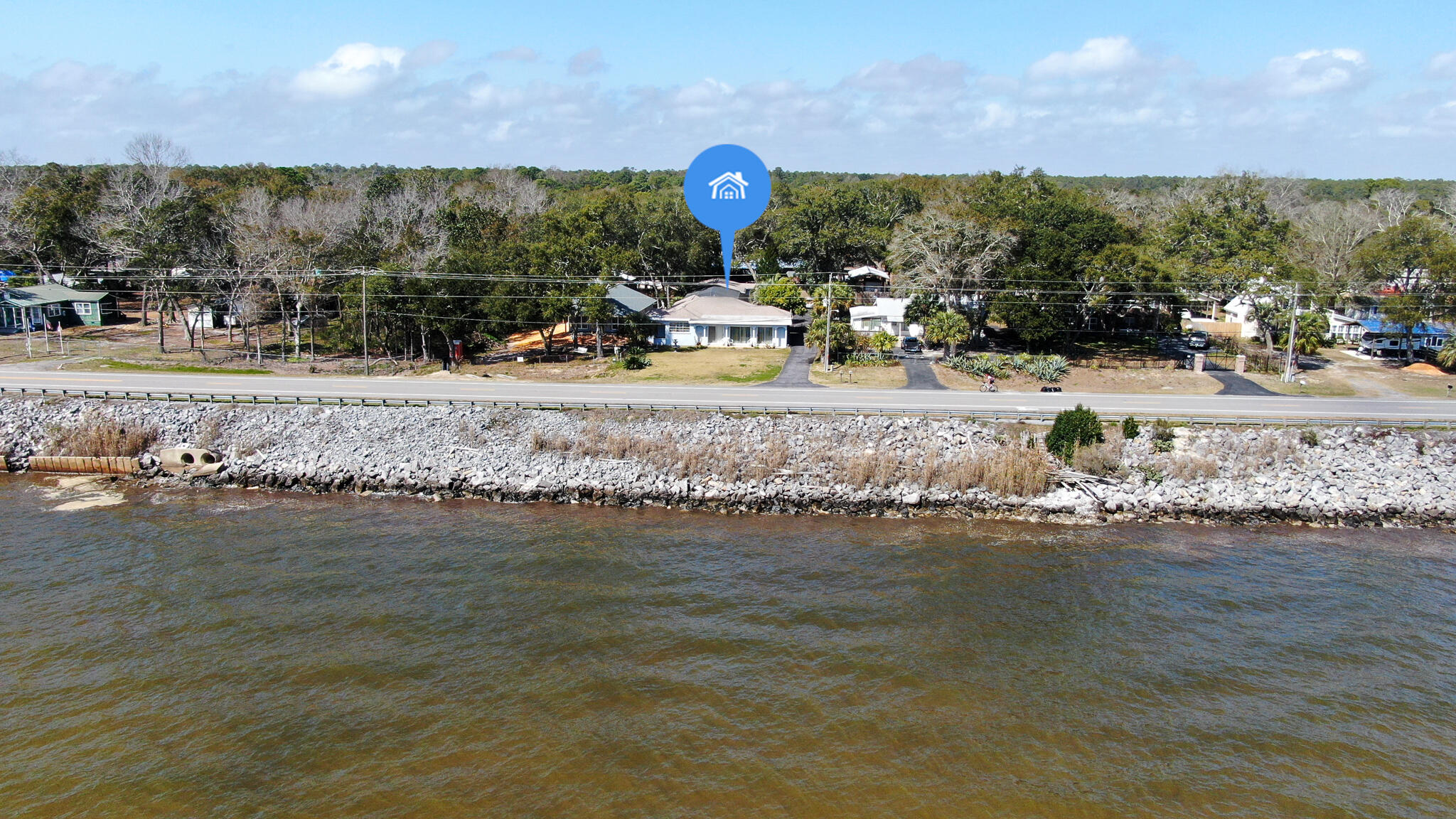 Charming Old Florida Bay Front Home, With Beautiful Views of Choctaw Bay. This three Bedroom two Bath home features an inground screened-in pool and a separate two car garage with plenty of storage for all your toys. Three is no HOA and The home is a real Charmer Built in 1956 with Real hardwood and tile flooring through-out. And has been very well Maintained by a caretaker since the seller purchased the property in 2005. The Landscape has a beautiful old Florida feel With Several Palms, hardwoods for shade, Persimmon and Citrus Trees including Tangerines and Grapefruits. You'll love the magnificent views of Choctaw bay, and proximity to Freeport, Niceville and of course the white sands of the Gulf of Mexico. All within 20 Miles. and Destin Pass is less than 15 Miles away by boat.