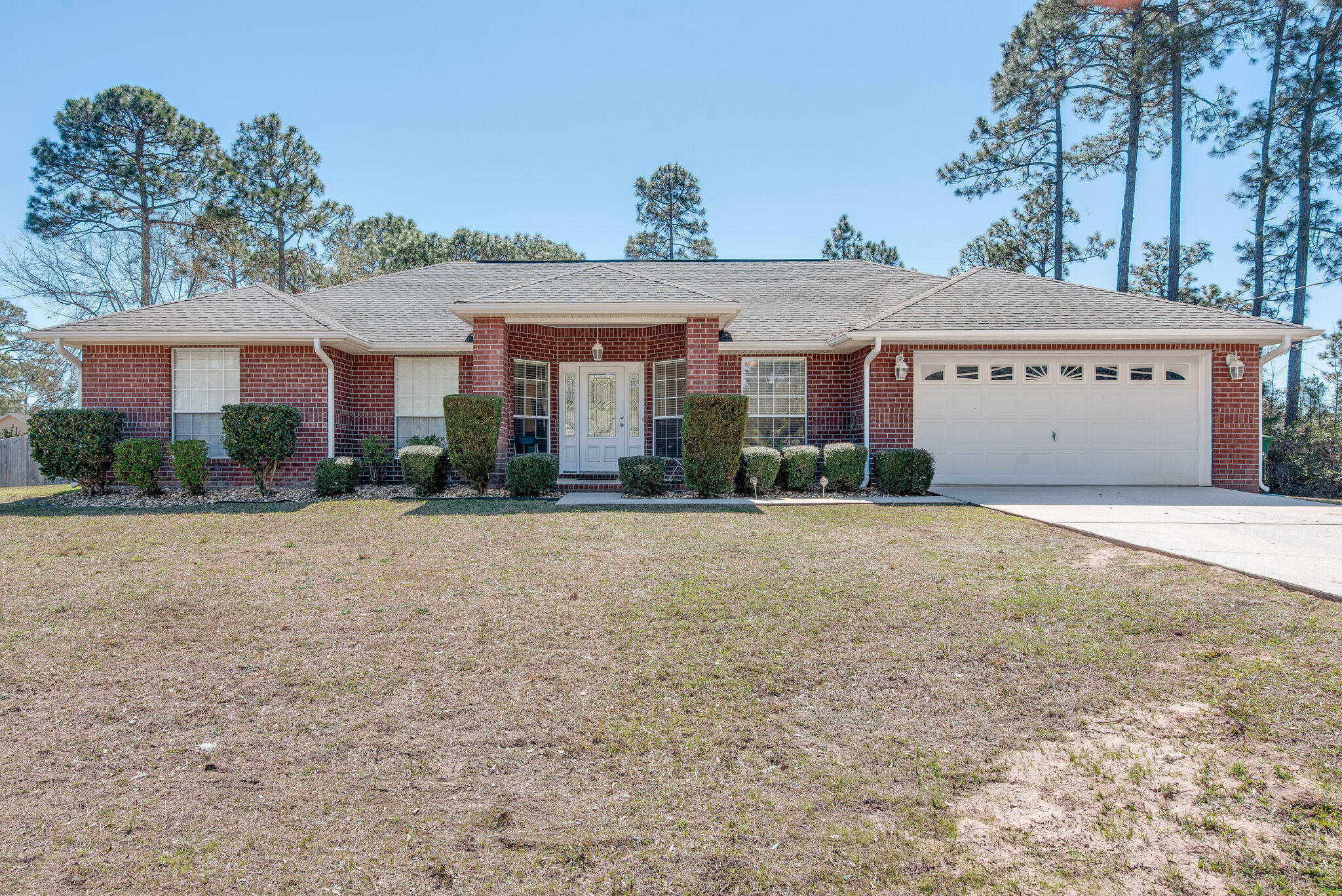 OPEN HOUSE Saturday 10am-1pm. Great ALL BRICK home in a perfect location, centrally located in Navarre with quick access to HWY 87, shopping and a 5minute drive to the beach. This home features a large family room with wood burning fireplace, office/study with french doors, large dining room and huge kitchen w/granite counters, breakfast bar and nook. A split bedroom plan with 2 spacious guest rooms and master suite w/sliders to the back yard, dual vanities, 2 walk in closets, garden tub & separate shower. The home is situated on over 1/2 an acre with a large open patio and gutters around the home. The septic was pumped in 2019 as well. You won't want to miss this superb buy in Navarre!