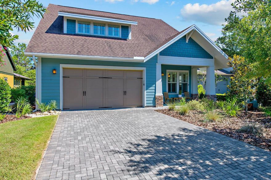 Inspired by the Arts and Crafts Movement and Craftsman architecture of the early twentieth century, the gated enclave of Wild Heron sprawls 734 acres and 13,500 feet of Lake Powell shoreline. Spanning two levels and over 3,400 square feet, 1708 Skimmer Court exemplifies the uniquely coined 'Coastal Craftsman' flair found throughout the community incorporating elements like expressed framing, dormer windows, multiple roof planes, and southern vernacular influences. Framed with stately columns and stacked stone accents, the welcoming front porch leads the want to the entry hall and formal dining area.