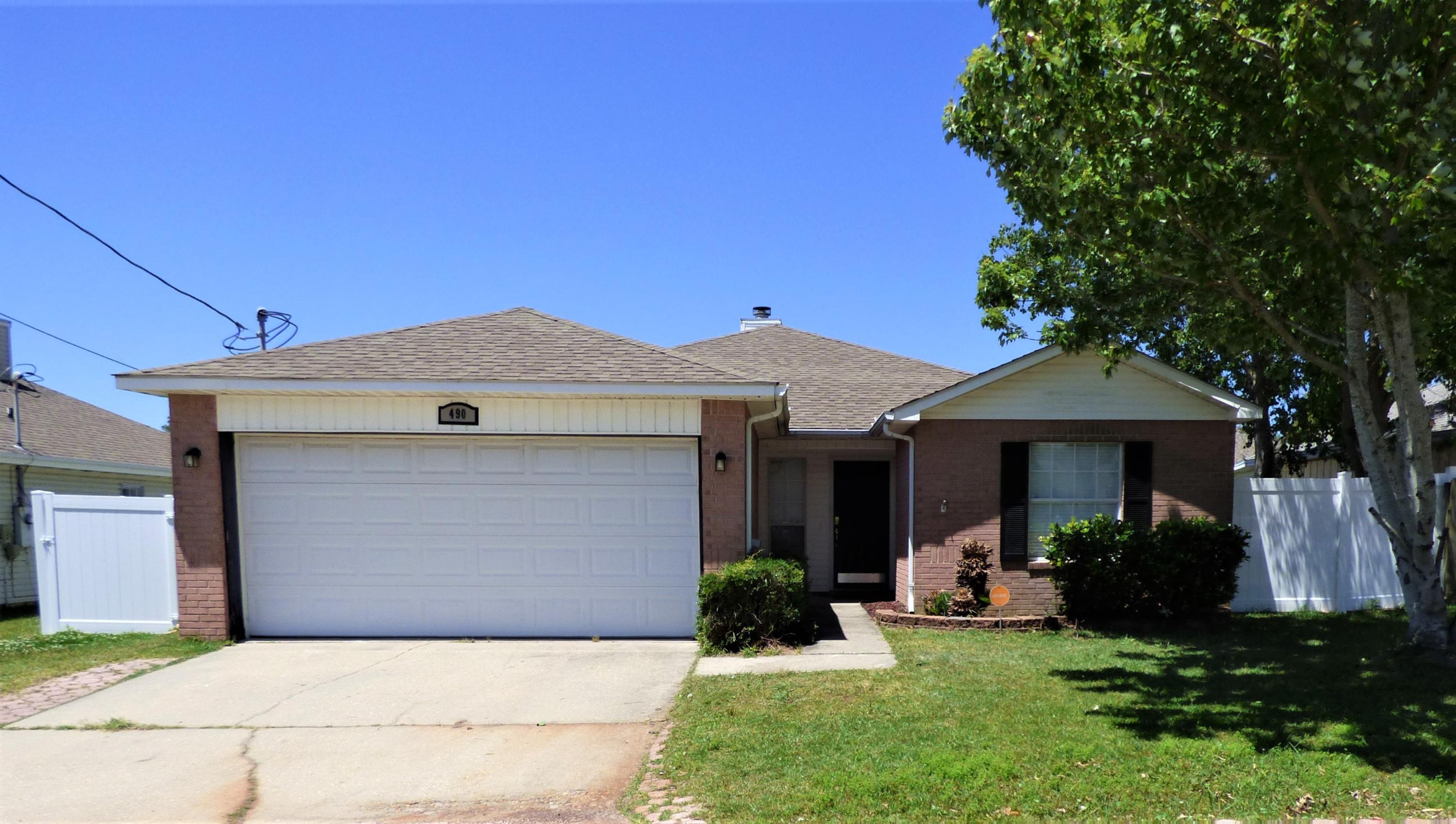 AFFORDABLE, MOVE-IN READY AND APPROX 2 MILES WEST OF HURLBURT BASE.... this 3 bedroom/2 bath brick/vinyl home will check most of the boxes. The living room is spacious and features a vaulted ceiling and fireplace for those cool evenings or added atmosphere. The kitchen has good cabinet and counter top space, a breakfast bar, a pantry/closet off the adjoining dining area. Sliding glass doors leads to the covered porch, a great fenced-in backyard. The master bedroom is generous in size with a walk-in closet and master bath with double sink vanity and garden tub. The other 2 guest bedrooms have ample space and closets with a guest bath located in between. Large laundry room between the kitchen and garage has shelving for additional storage and pantry items.