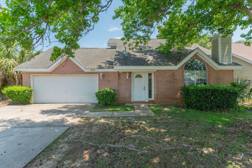 Welcome to 425 Bristol Cove Road, a charming and well-maintained home in the peaceful Bristol Park neighborhood of Mary Esther. This 3-bedroom, 2-bathroom residence offers just over 1,200 square feet of comfortable living space with a thoughtful split-bedroom layout that gives everyone a little extra privacy. The primary suite is conveniently located on the first floor, while two additional bedrooms and a full bath are tucked away upstairs. Inside, vaulted ceilings and plenty of natural light create an airy, welcoming feel. The kitchen includes a pantry and comes equipped with all the essentials, including an electric range, microwave, refrigerator, and dishwasher. Tile and carpet flooring throughout the home provide both durability and comfort. The living area flows seamlessly into the dining space, making entertaining easy.

Outside, you'll find a fully fenced backyard with room to garden, play, or just relax in the Florida sunshine. An attached two-car garage offers ample space for parking and storage. The home is situated on a manageable 0.10-acre lot, just minutes from shopping, restaurants, Hurlburt Field, and the sugar-white sands of the Emerald Coast.