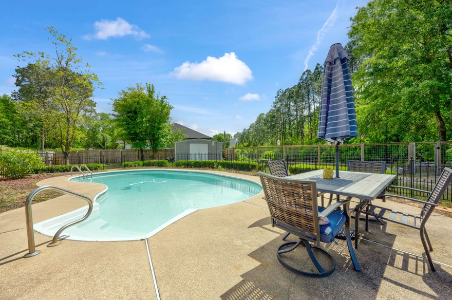 Want waterfront property without the high price tag? Step into luxury with a spacious primary suite featuring an ensuite bath with a gorgeous garden tub, resort-style shower with multiple shower heads, makeup counter, and dual closets with stylish barn doors. The large kitchen is a chef's dream, complete with quartz countertops, a huge island, and stainless steel appliances installed in 2022. The third bedroom, with its own half-bath and separate entrance, offers versatile options such as an at-home office, mother-in-law suite, or convenient guest wing. Natural light throughout the home creates a cheerful space to come home to. Whether relaxing in the pool on hot summer days, hosting family and friends, gardening in the prepared beds, or sipping coffee from your private access to the can al, this backyard is loaded with amenities. No HOA building or usage restrictions. Motivated sellers are relocating for a new job, so this fully updated gem in Milton, FL, is up for grabs! Renovations in 2022 included a new roof, HVAC and water heater replacement, luxury vinyl flooring installation, new paint, a new pool pump, and more. Located in Waterview Estates, just one block from the community park and boat launch for easy access to Blackwater Bay, this is one property you will not want to miss!