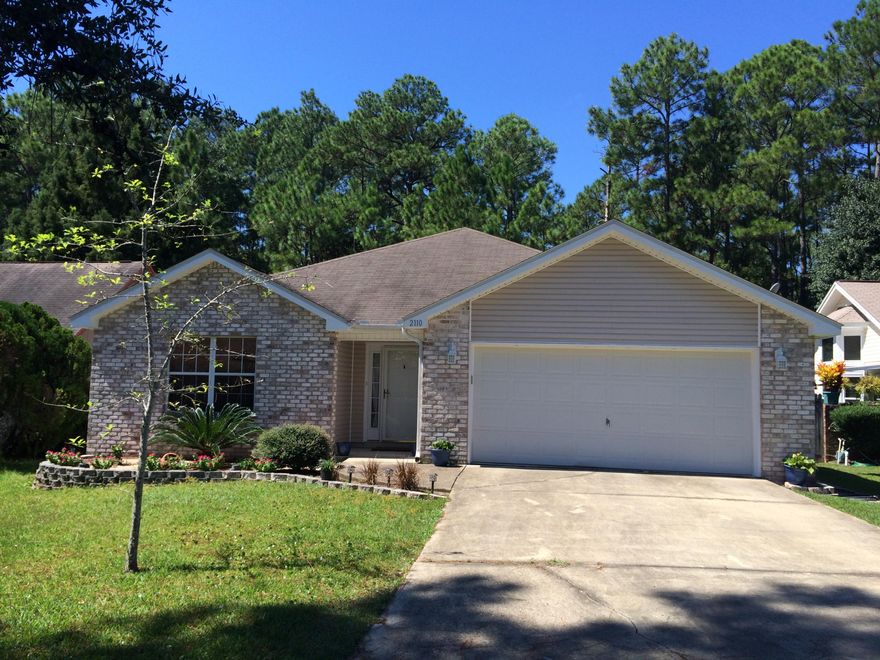 Welcome home! This three bedroom 2 bath beauty is nestled on one of the largest lots in the neighborhood AND backs up to the reservation for privacy. Brick front with vinyl sides for easy maintenance and loads of parking! Living area sports 12 ft ceilings, recessed lighting, nice wood laminate flooring and is open to eat in dining area, breakfast bar and kitchen. Master is spacious with a walk in closet and master bath provides double vanity. Enjoy cookouts on the wooden deck just off the living area. Currently tenant occupied until the end of October.