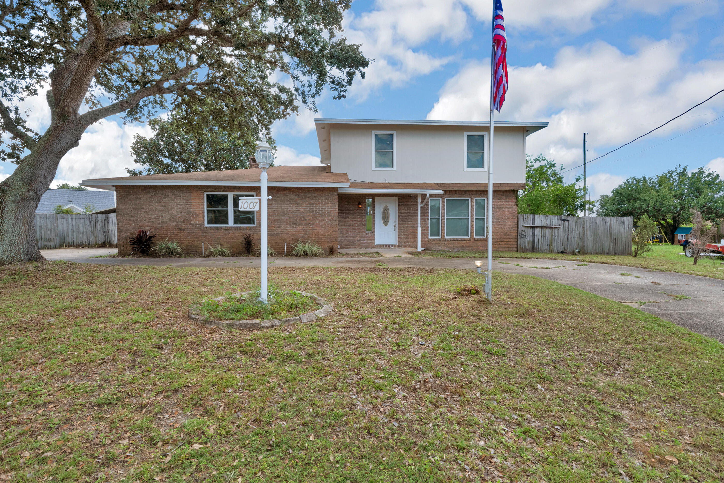 Welcome home to the new version of this classic colonial! New paint, new flooring, new kitchen including can lights, fixtures, cabinets and granite, laundry room closed in for additional square footage living space (approx. 120 sf). New take on the stairs, freshened up fireplace. Master Bath and Half Bath fully upgraded, Hall Bath updated. Separate living spaces, but open enough for great entertaining. Back yard is huge (fencing still being repaired). Unexpected water views from the upstairs balcony that wraps around the back of the house, because it's just north, of Highway 98. Convenient to Hurlburt and just a quick trip West to the Beaches of Navarre or East to Destin. Roof 2010, water heater 2011 to gas, public sewer, Hardi-Plank siding 2012. Sprinkler system sold As-Is.