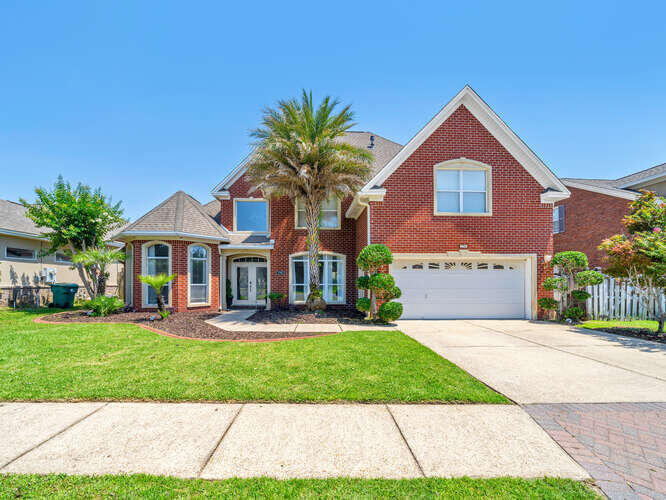 Welcome to an unparalleled living experience inside the exclusive, gated enclave of Bridgeport Colony. Nestled in the heart of Fort Walton Beach, this stunning five-bedroom, three-bathroom estate spans an impressive 2,735 square feet and is perfectly positioned for effortless commuting to both Eglin Air Force Base and Hurlburt Field. But beyond its prime location, this home is an entertainer's dream--a true masterpiece crafted for luxury, comfort, and unforgettable gatherings.As you step inside, the grandeur of 20-foot ceilings welcomes you, flooding the space with natural light and creating an airy, open atmosphere. The heart of the home, the living room, is designed for both relaxation and hosting, featuring a cozy gas fireplace and ample space for your most inviting, oversized furniture. Adjacent, the formal dining area offers an elegant space for dinner parties, just off the striking atrium.

For the culinary enthusiast, the kitchen is nothing short of spectacular. Designed for a master chef, it boasts a top-of-the-line professional gas stove complemented by a commercial-grade hooded vent. Stainless steel appliances shine against sleek granite countertops, while LED under-cabinet lighting enhances the modern aesthetic. A spacious eat-in area makes this kitchen the perfect blend of function and style.

The primary suite is a sanctuary in itself, privately tucked away on the first floor for the ultimate retreat. Tray ceilings, recessed lighting add to the ambiance, while his-and-her closets and a spa-like ensuite bath complete the experience. Here, a generously sized jetted jacuzzi tub awaits, inviting you to unwind in pure luxury.

The first floor also features an ensuite guest retreat, perfect for visitors seeking privacy and comfort. Even the laundry room has been transformed into a work of art, newly renovated with "Magnolia House"-inspired charm.

Step outside, and you'll discover a lush, tropical oasis within your own backyard. Enclosed for maximum privacy, this space is designed for year-round enjoyment. A six-person hot tub, complete with LED lighting and wireless audio connectivity, sets the stage for relaxation. If the spa isn't your speed, take a refreshing dip in your very own private gunite pool; an entertainer's dream come true.

But the entertainment doesn't stop there. Ascend to the second floor and experience the pinnacle of movie nights in your custom-designed home theater. Outfitted with state-of-the-art sound, a high-end projector system, plush leather stadium seating, and even a snack bar, this space rivals any cinematic experience.

Upstairs, additional bedrooms provide ample space for guests or family, while an oversized attic offers the perfect storage solution for holiday decor and keepsakes.

While the home boasts its own private pool, residents of Bridgeport Colony also enjoy access to a meticulously maintained community pool. The HOA ensures the grounds remain pristine, with beautifully landscaped surroundings and a pavilion that serves as the perfect gathering space for neighbors and friends.

Exclusive. Grand. Designed for those who appreciate the finer things in life. Welcome home to Bridgeport Colony; where every day feels like a getaway.