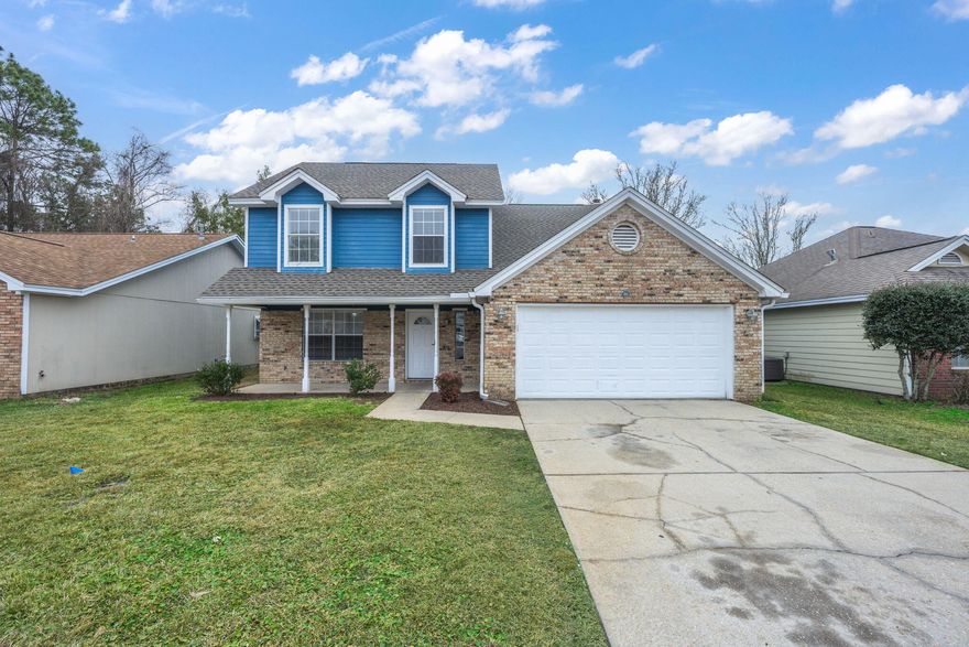 Move-in ready 5-bedroom 2.5 bath home with 1638 square feet of comfortable living space and is ideally located just 6 miles from Eglin Air Force Base, 8 miles from Hurlburt Field, and 6.5 miles from the sandy shores of Okaloosa Island. Convenient amenities such as Aldi, Lowes, Kohl's, fast-food and restaurants, schools, and various shops and services are all nearby, providing easy access to everything you need. Home has brick and vinyl exterior with covered porch. Immediately walk into the tile foyer and into the spacious living room, next to the bright, large open kitchen with an eat in dinette area and white cabinetry and appliances.  Kitchen has laminate countertop and a tile back splash plus a new kitchen sink faucet. Home has new blinds, light switches and new ceiling fans throughout. Down the hall is a stackable washer and dryer for easy access. Half bath with new vanity downstairs and one bedroom with a wood burning fireplace. Upstairs has the master bedroom and large walk in closet, and master bath with tub/shower combo and three additional bedrooms. The double car garage offers plenty of parking inside and four car space driveway plus a privacy fenced back yard. Don't miss out on this gem...location...location...location!