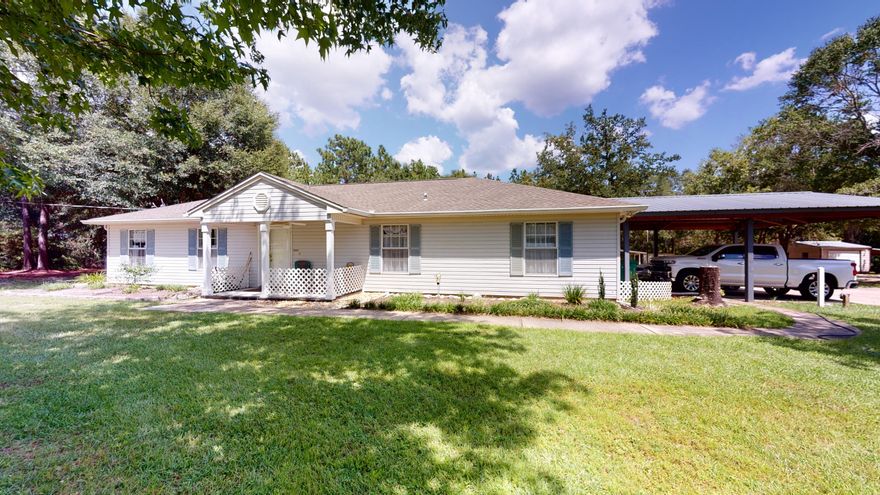 If you are looking for some peace and quiet but want to be close to town, look no further! This immaculate, 4 bedroom, 2 bathroom home is nestled on 2.3 acres at the end of a dead end street less than 5 miles from shopping and restaurants. When you walk into the home, you will love the newly remodeled kitchen which opens up to the dining room and living room. The wood burning fireplace makes for a very cozy living space. You don't want to miss the oversized Florida room which is over 500 square feet! It's the perfect place to have a cup of coffee as the sun rises. The whole home has been painted and the roof was replaced in 2016. The three utility sheds (all with new metal roofs) and the RV shed allow for plenty of storage and all have power.