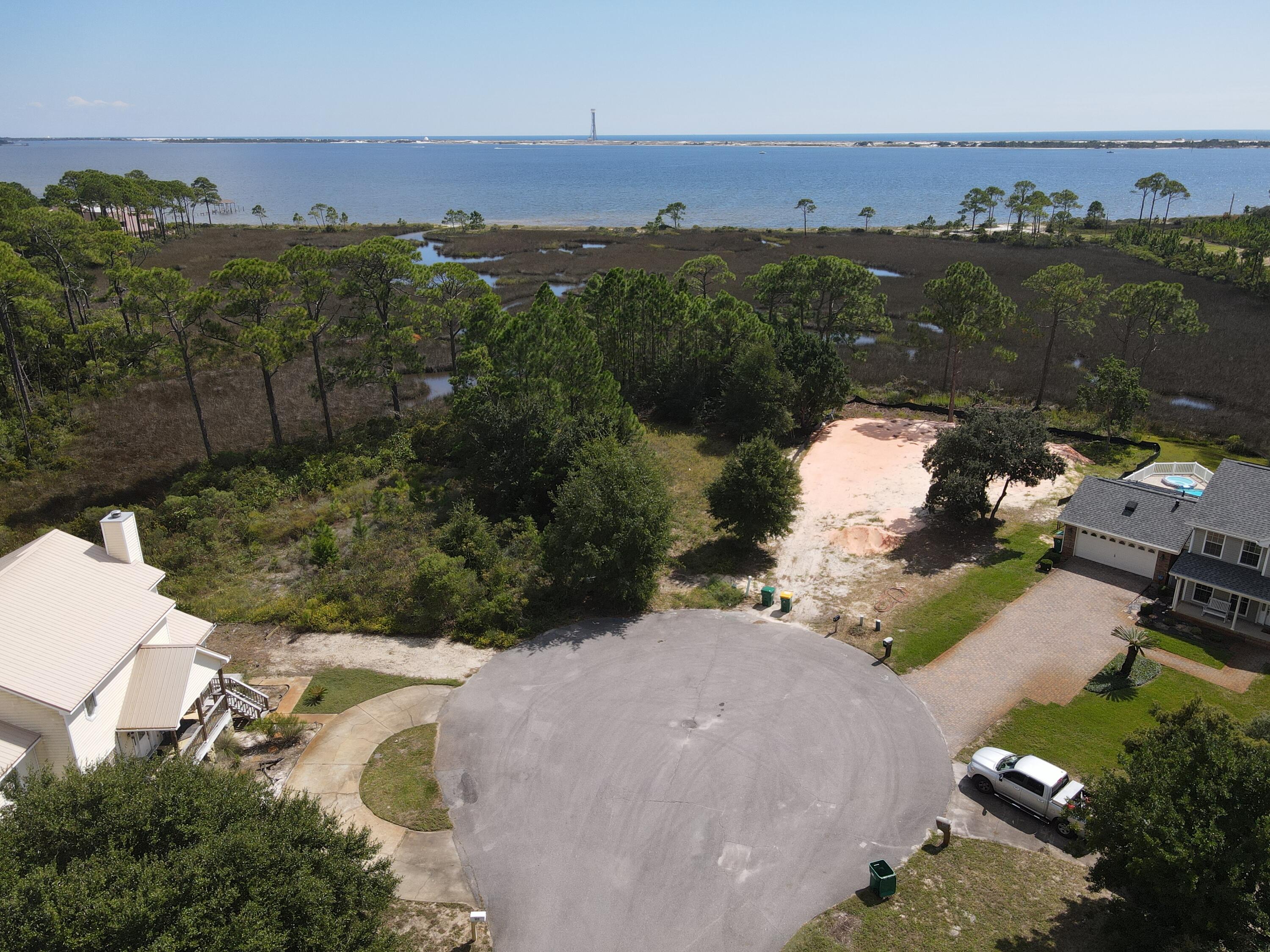 Vacant residential lot in the beautiful neighborhood of Emerald Pointe. This platted lot is situated on a cul-de-sac and backs up to a salt marsh providing unobstructed views out to the waters of the Santa Rosa Sound. Come and build your dream home today!