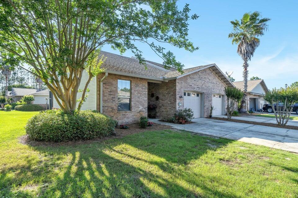 This charming 3-bedroom, 2-bathroom home features a first-floor master bedroom, a versatile loft bonus area, screened in back patio and a 1-car attached garage. The property includes a washer and dryer for your convenience. Nestled in a vibrant community, you'll enjoy access to a playground, pool, tennis courts, and a scenic nature trail that leads directly to 30A. Additionally, a nearby ski lake offers the unique opportunity to watch world-renowned water skiers train daily, adding a touch of excitement to your daily routine. This home perfectly blends comfort, convenience, and recreational amenities.
