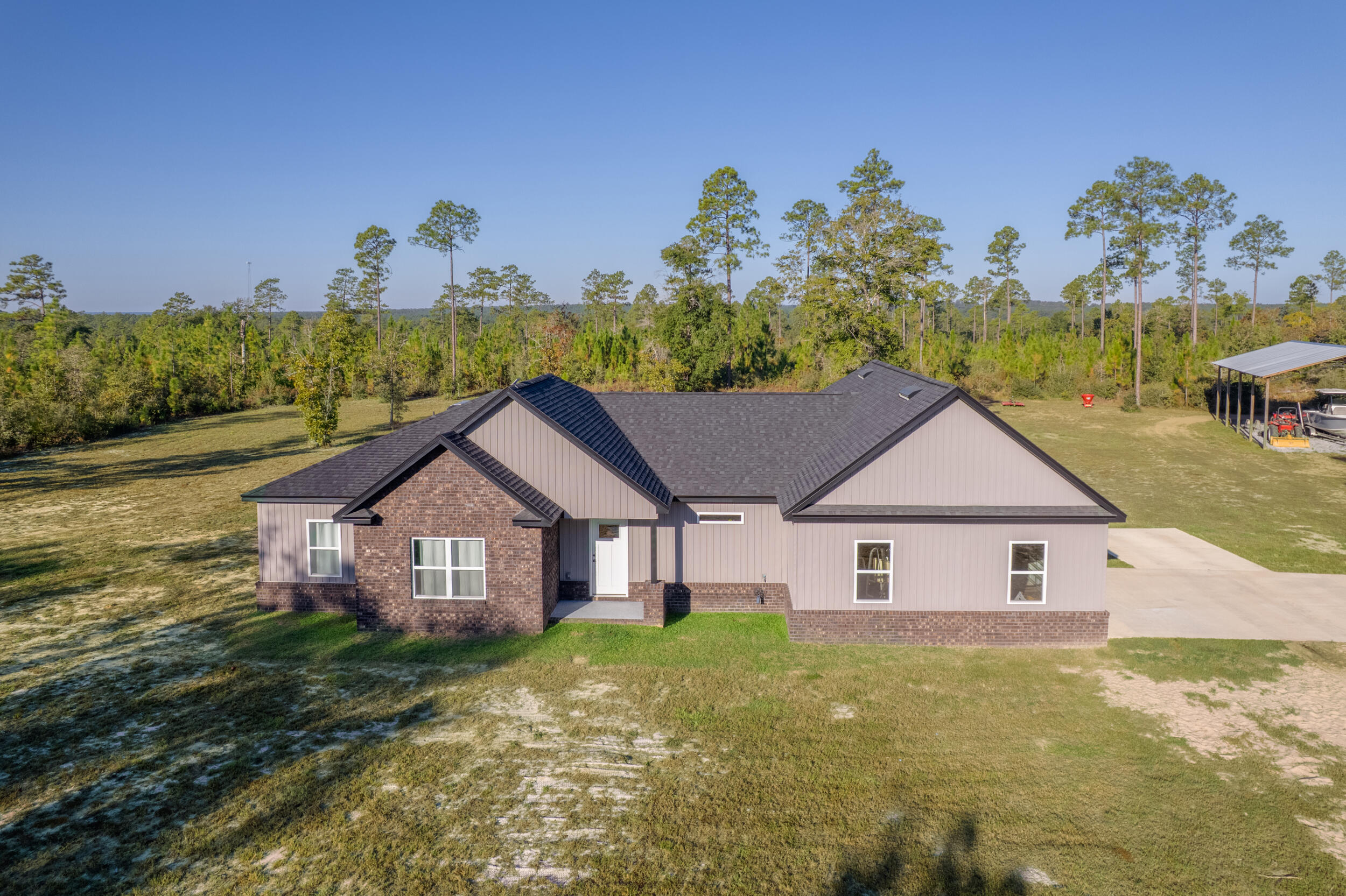 Welcome to your dream oasis! This custom built 2024 3 bedroom, 2 bath with flex space is being offered with 12 +/- acres. Also available with 40 acres (see other listing). If you are looking for peaceful living, recreation and homesteading, then this is for you. When the weather is cold or you are looking for ambience, inside you can cozy up in front of the electric fireplace or sit outside by the fire pit. This open floor plan provides space and luxury. This home is filled with country charm from the flooring, tile and lighting choices. The position of this home offers natural light that fills the home inside. Outside enjoy the stunning west facing sunset. There are lots of deer and dove that visit this property daily.