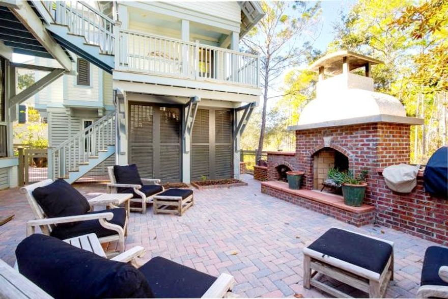 This home is in the premier location of WaterColor with incredible lake views.  There is plenty of room to add a large pool and a great outdoor kitchen if buyer so desires.  For entertaining, no detail is left out of this home. This large cottage-style home will accommodate a large group, but is still cozy & comfortable. Recently updated kitchen and bathrooms, fresh paint and new furniture are just a few of the recent enhancements to this house. The main home's first level includes 3 bedroom suites, a home office that can be converted into a bunkroom , a TV den, laundry and 4 full baths. The second level features an open living/kitchen/dining plan, the master suite and another full bath.