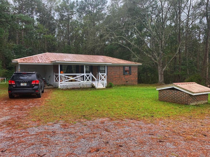 Cozy and cute brick house on over 2 acres. 3 bedroom 1 bath. Great starter home or rental. There is a large 22X10 back deck and 18x8 covered front porch. Living room is open to the dining room. The current owners recently painted and put down new flooring. This house is located in the country but still only 5 minutes to town. All measurements to be verified by buyer.