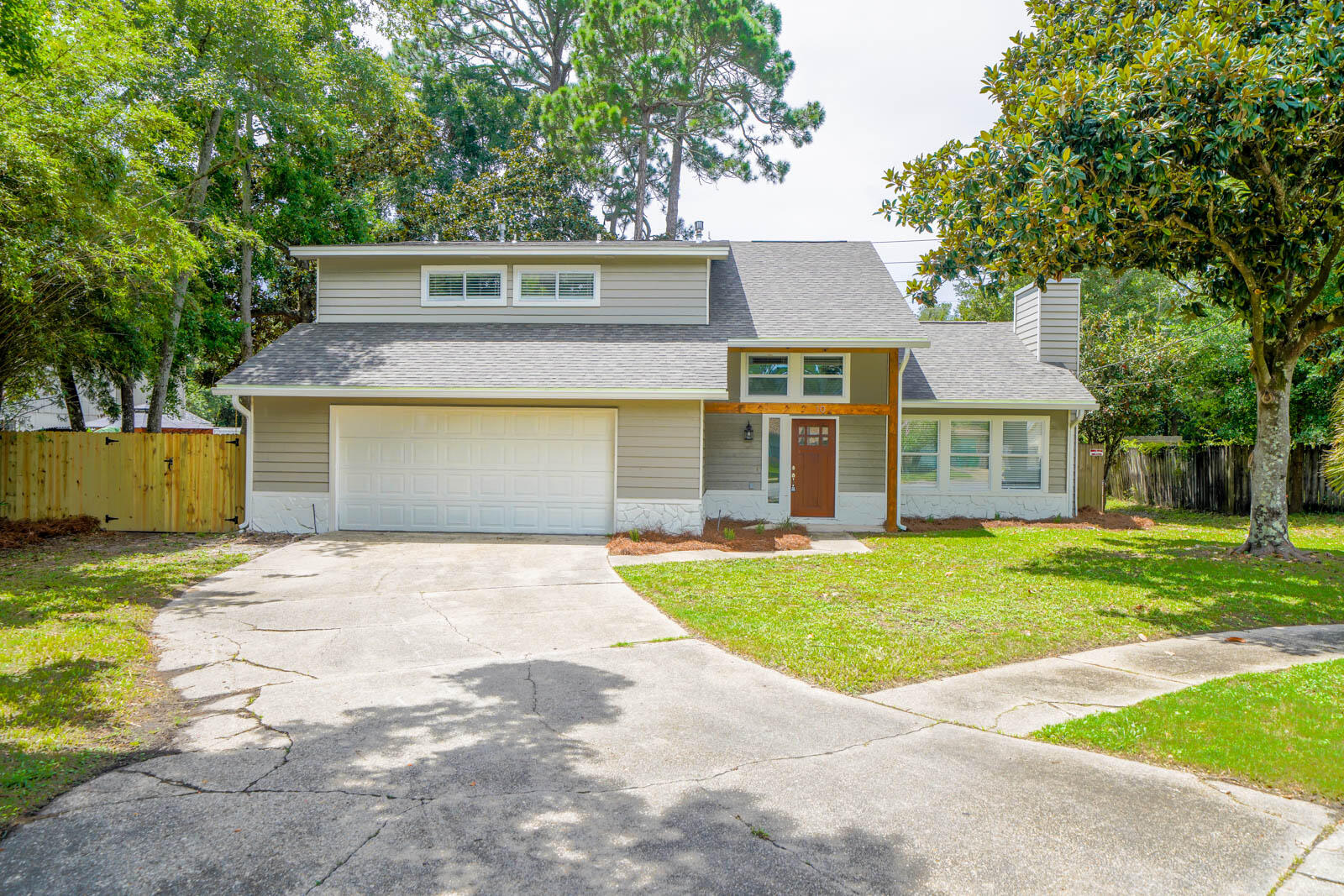 RENTED UNTIL OCTOBER 15th. Completely Updated in 2022 - Interior, Roof/HWH/HVAC, etc. NO HOA. Enjoy four bedrooms, PLUS a second living room upstairs. First floor master with sliding glass door opening to private backyard deck. Half-bath powder room on the first floor for the convenience of your guests. Convenient to Hurlburt Field, Eglin, Duke Field, Navarre Beach, Destin, Okaloosa Island, area Hospitals , Publix, Target. Less than 1/2 mile to the water - your feet could be on the sugar white sand in as little as 10 minutes! New fixtures, paint, flooring, bathrooms, counter tops, cabinets and High-End Stainless Appliances in 2022. Charming modern features such as shiplap, exposed beams, wood burning fireplace, privacy fence, Natural Gas, irrigation, and more.