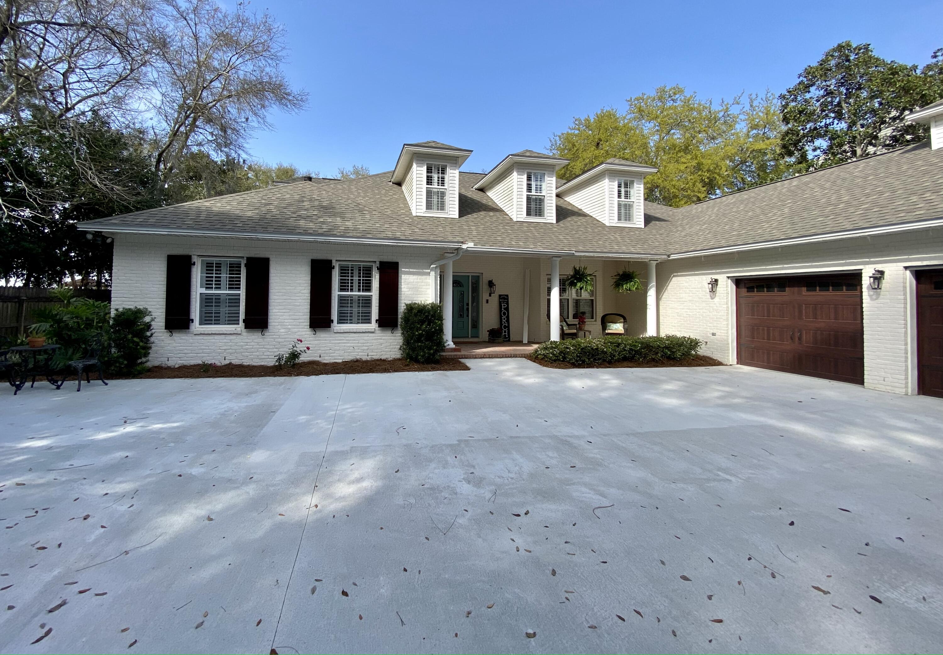 Professional pictures coming soon. This home has recently been remodeled. Private dock leading out to the bay with jet ski lift. Private screened in pool with an additional screened porch off the kitchen area. Two Master Bedrooms on ground Floor with new bathrooms and closets. Bayfront estate size lot with new driveway and a gated front drive and an RV hookup. Coffee bar in the kitchen area and huge laundry room with another room for an office or workout room. Additional storage or workshop off the oversized garage heated and cooled. All dimensions to be verified by buyer.