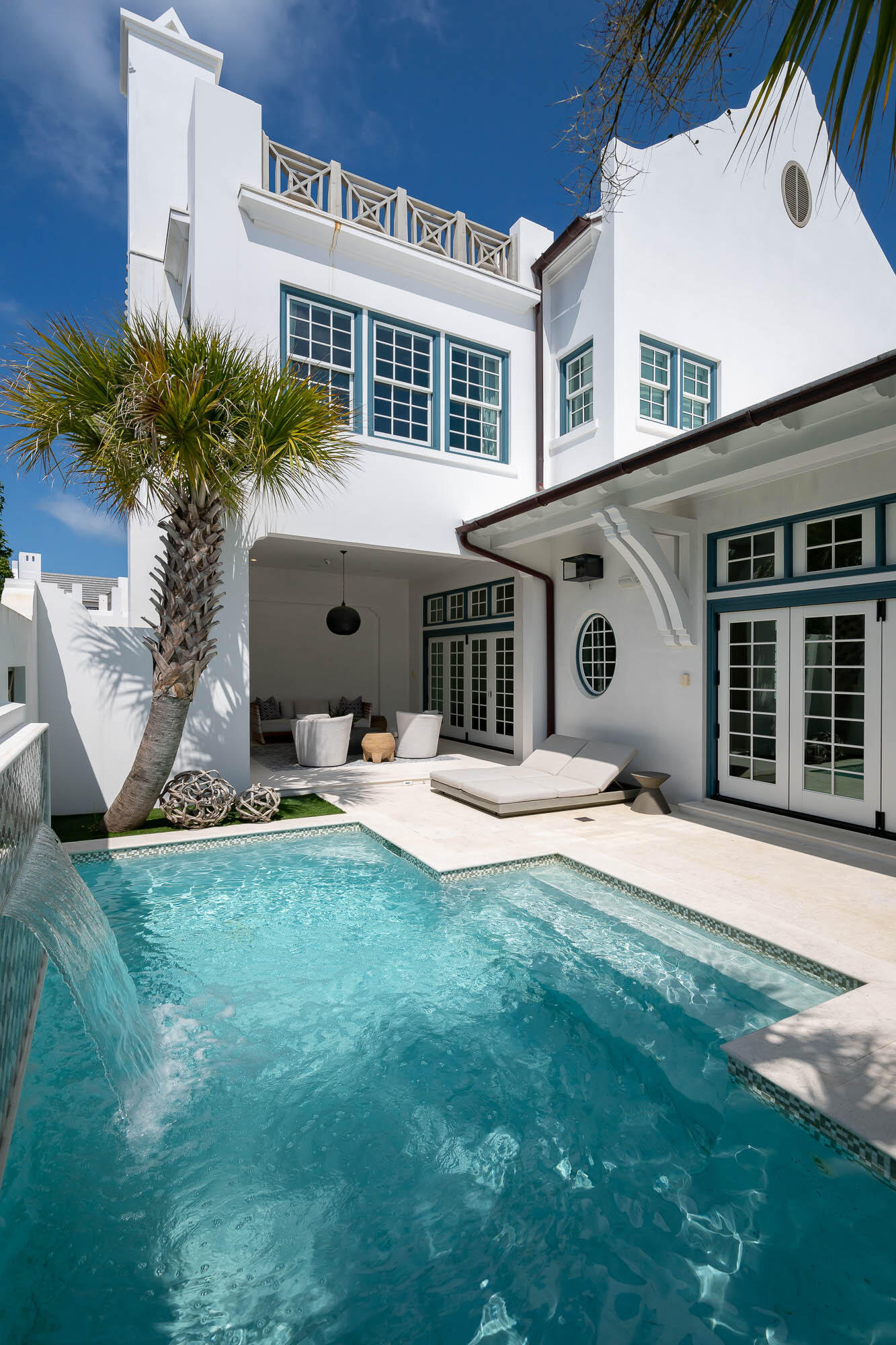 Location and great design define 73 Whalebone Alley in Alys Beach. A large third floor rooftop terrace is perfectly positioned looking down the entirety of  Turtle Bale Pedestrian Path to its final completion at the Gulf of Mexico. This freestanding home sits on a large 50'x100' homesite which architect, T.S. Adams Studio, used to maximize generous first floor living and outdoor spaces to give the feel of a private resort. From the venetian plaster to the custom tile selections, upgraded finishes and appliances are found throughout the 3,831 square feet. Upon entry from Turtle Bale Park, a large foyer grants a proper welcome to the house. The kitchen, living, and dining areas open to the oversized courtyard/pool area and covered loggia through two sets of bi-folding door systems. An