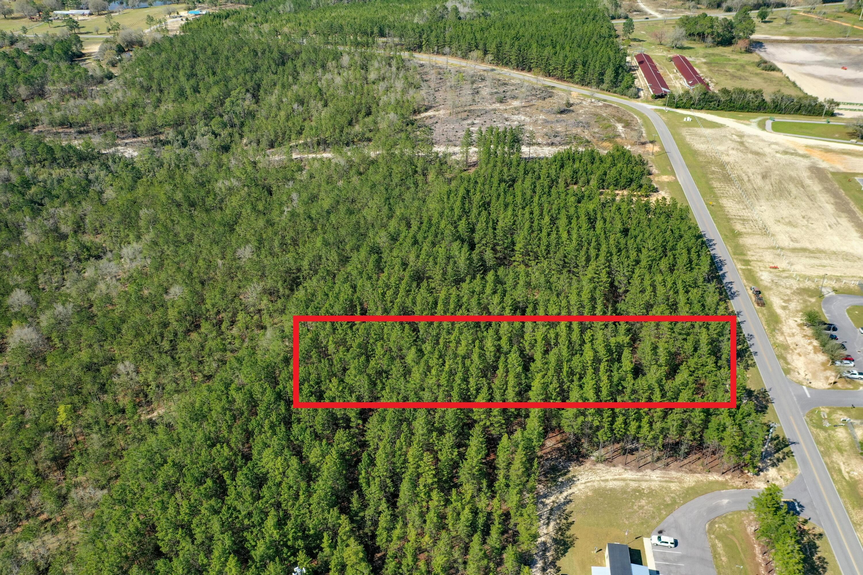 Capitalize on large track acreage in rapidly developing DeFuniak Springs. Currently zoned for general ag, but can easily be rezoned to business park commercial. Prime location for a multitude development possibilities. On city water, with a paved road access. Full of mature harvestable timber.